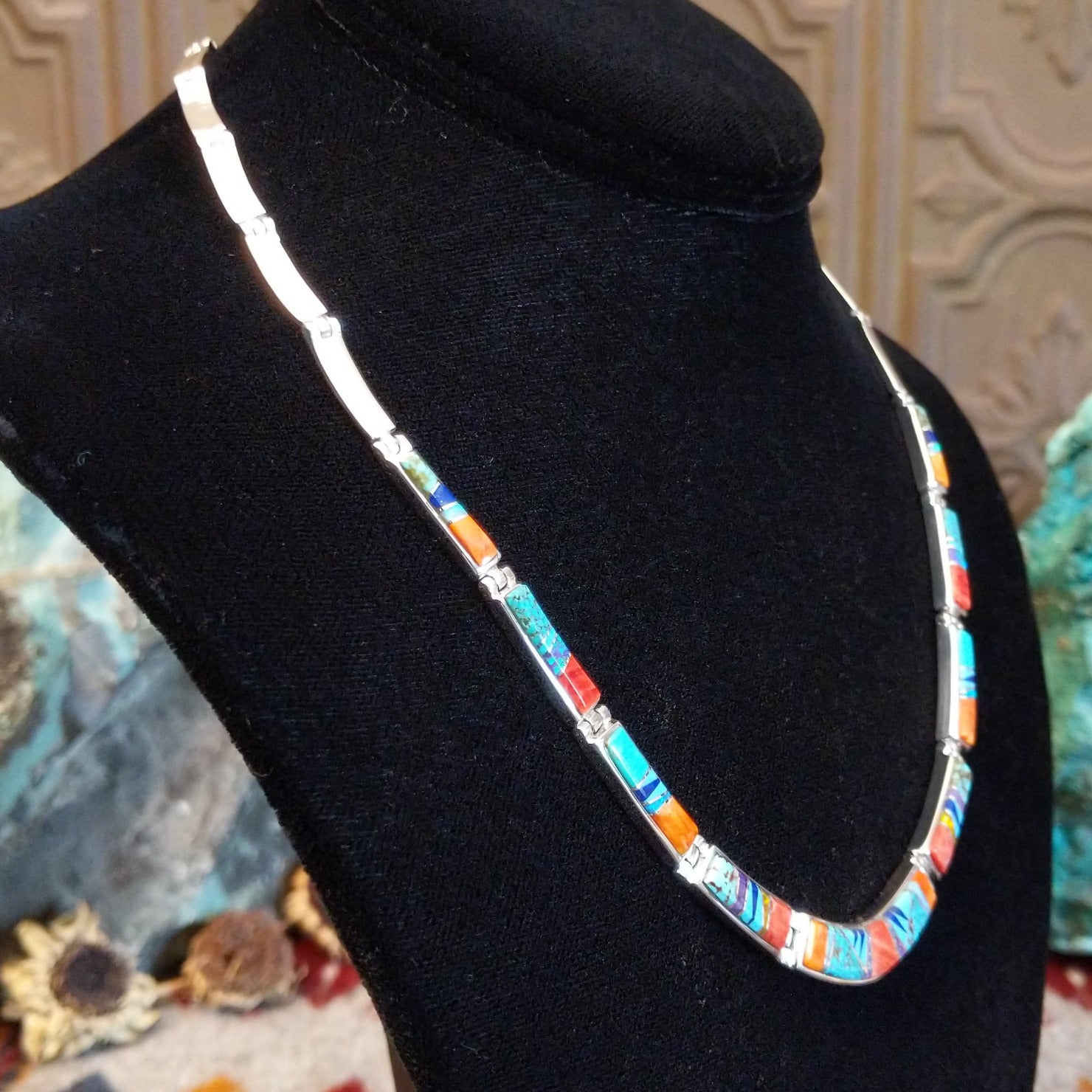 Sterling silver necklace and earring set with orange and red spiny oyster shell, turquoise, lapis, charoite, and manmade opal inlaid.
