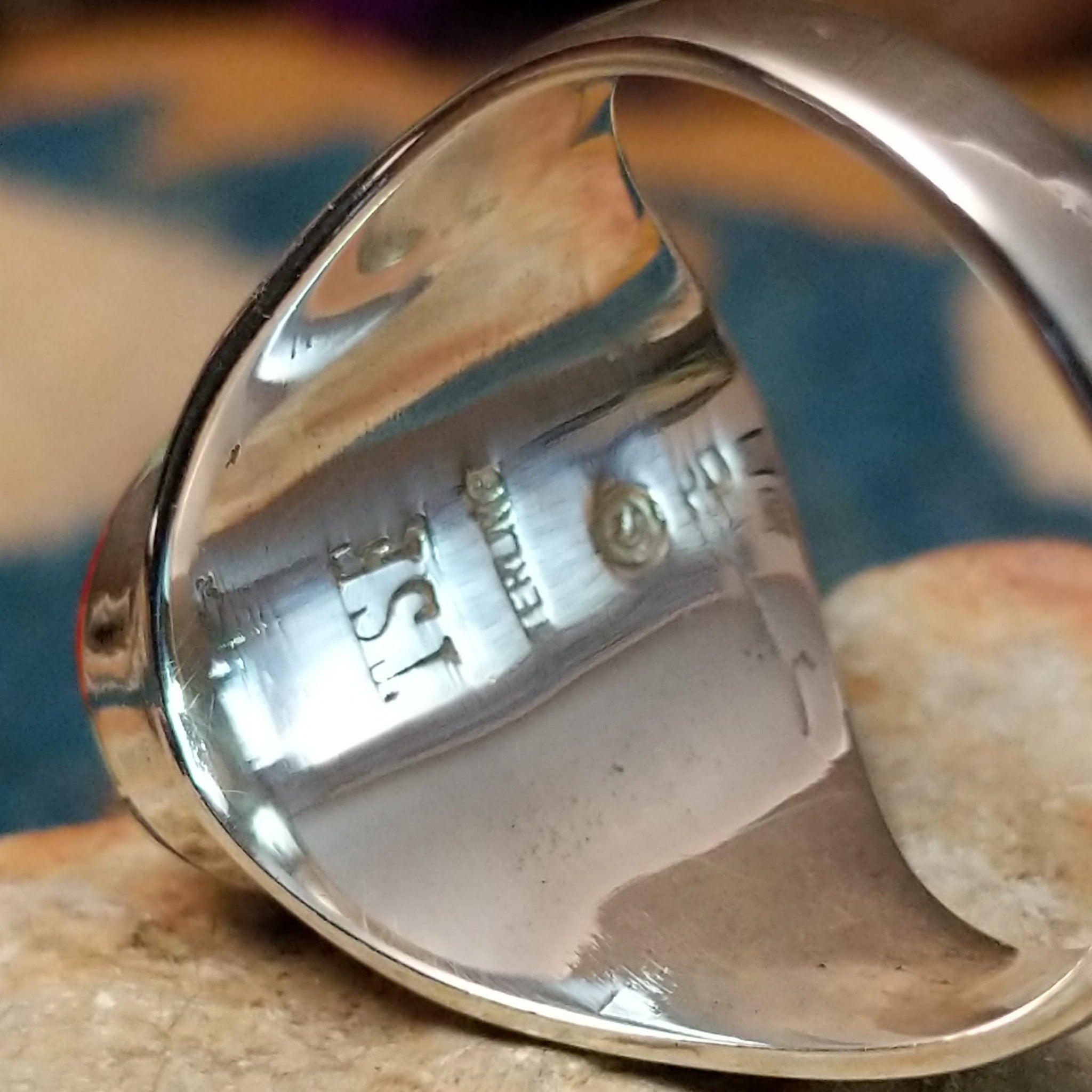 Sterling silver Navajo multistone inlay ring by P.D. featuring turquoise, red and orange spiny oyster shell, lapis, and geometric Southwestern inlay design; artisan and Sterling Silver stamp.