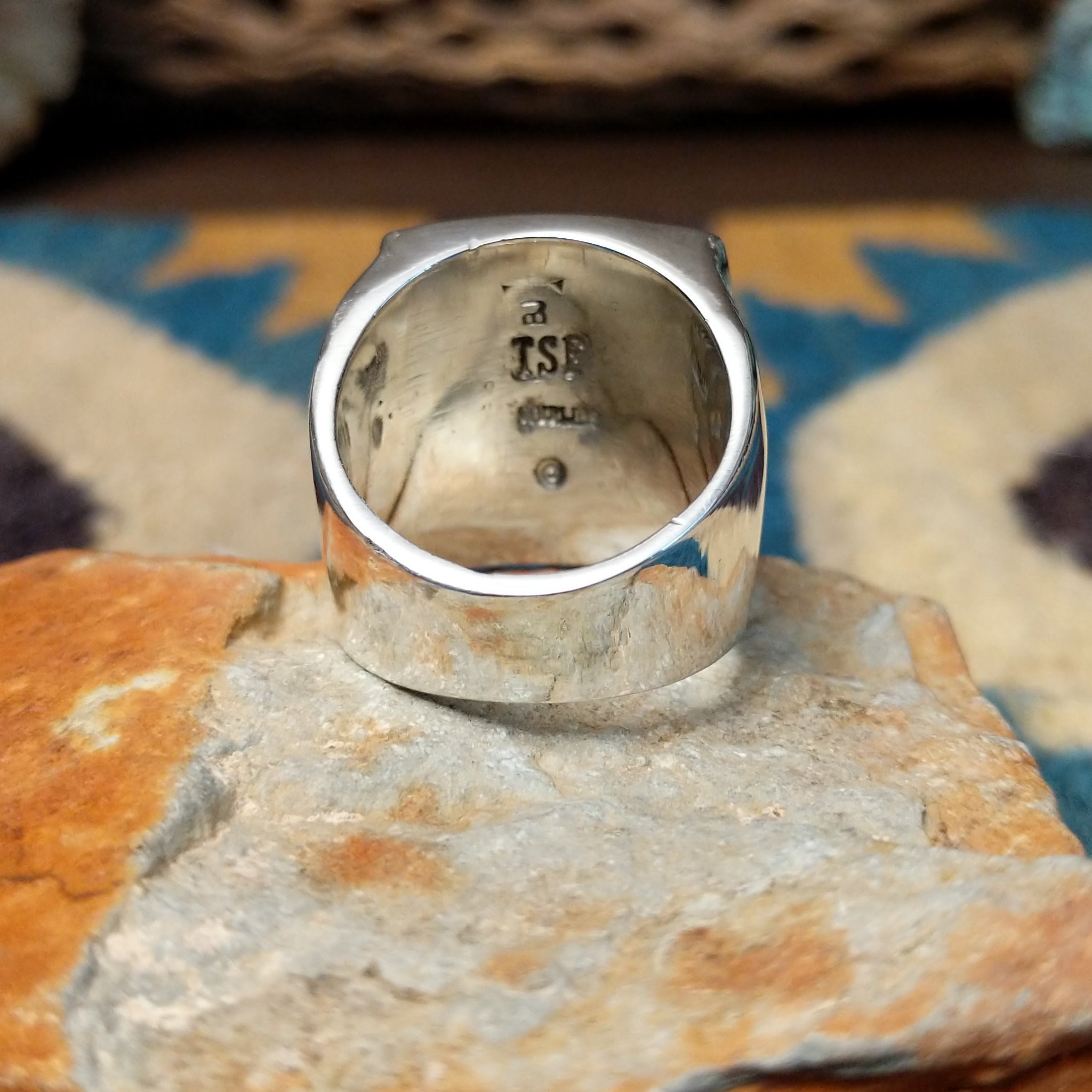 Handcrafted Navajo sterling silver ring by B.J. featuring a bold geometric inlay design in a polished silver setting with a contemporary Southwestern style; underside view.