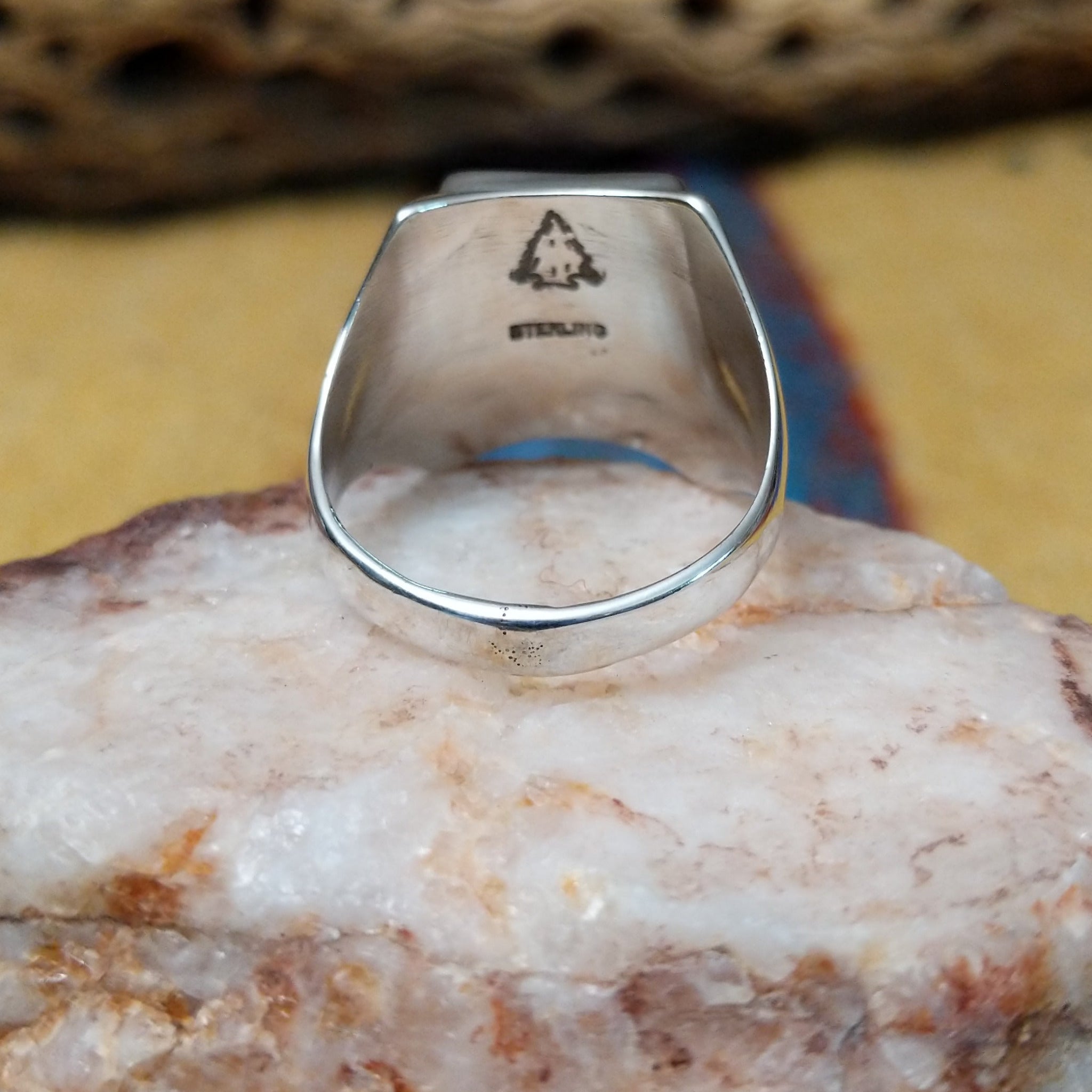 Navajo multistone mosaic ring, featuring a colorful mosaic of natural stones set in a handcrafted sterling silver band with traditional Southwestern-inspired craftsmanship. Underside view.