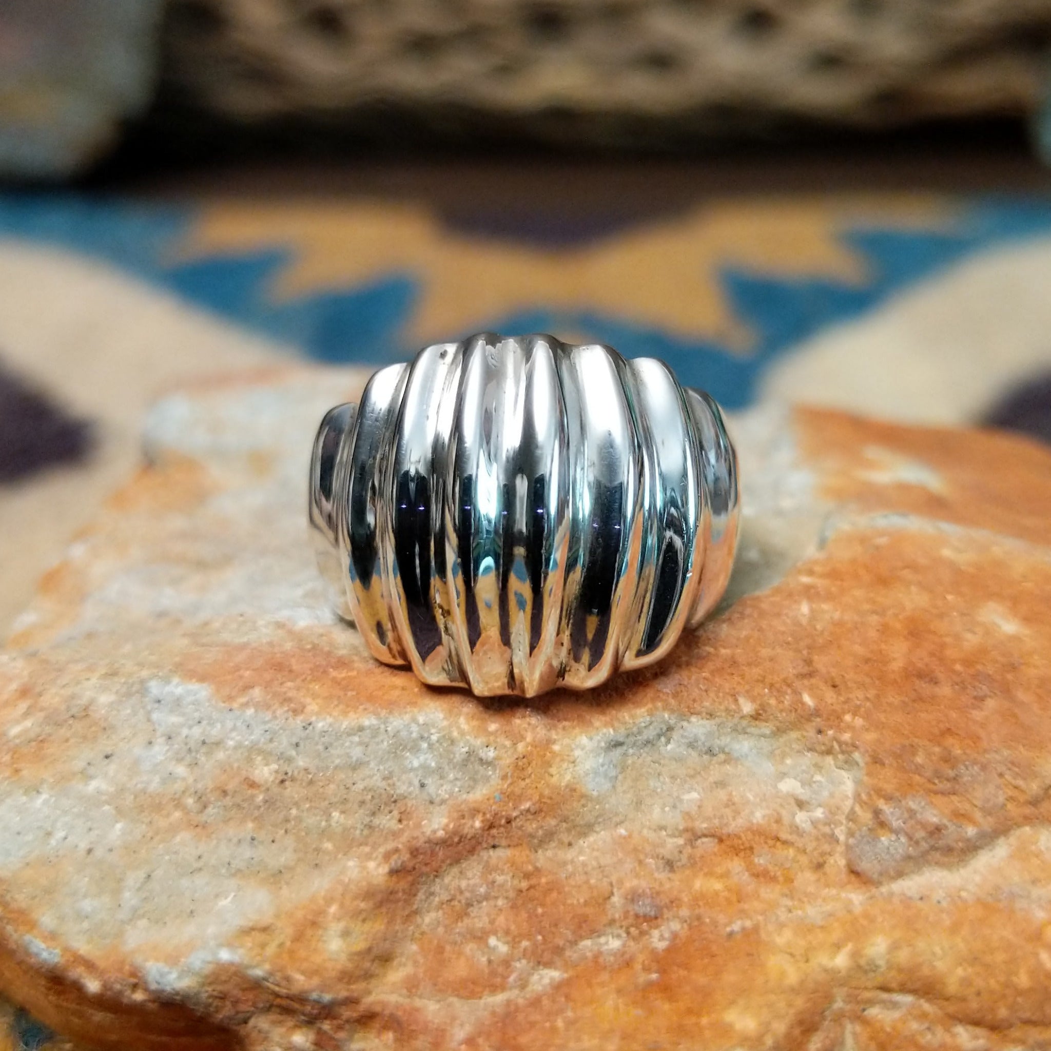 Handcrafted sterling silver Navajo ridged ring, featuring a polished domed design with bold vertical ridges.
