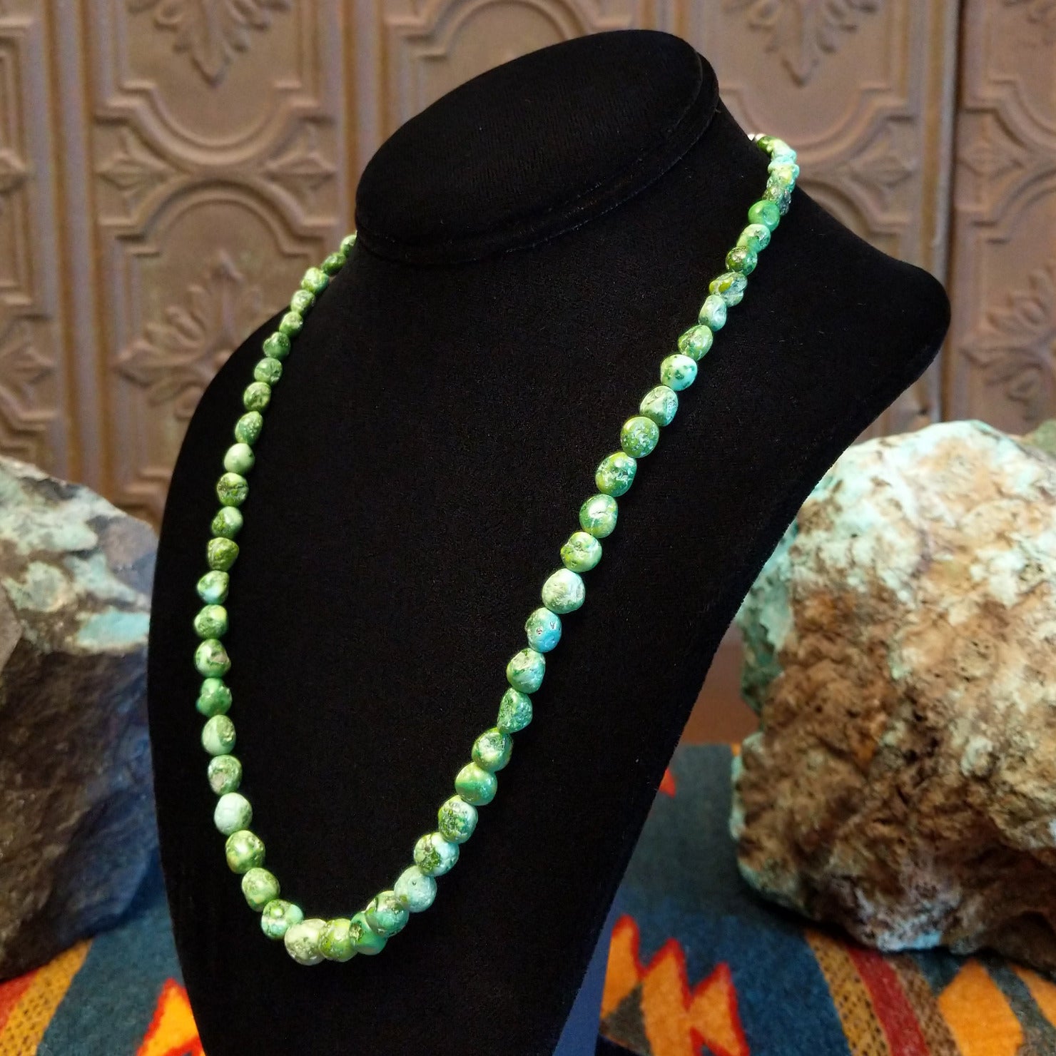 Rough cut Sonoran Gold turquoise beaded along the sterling silver chain of the necklace.