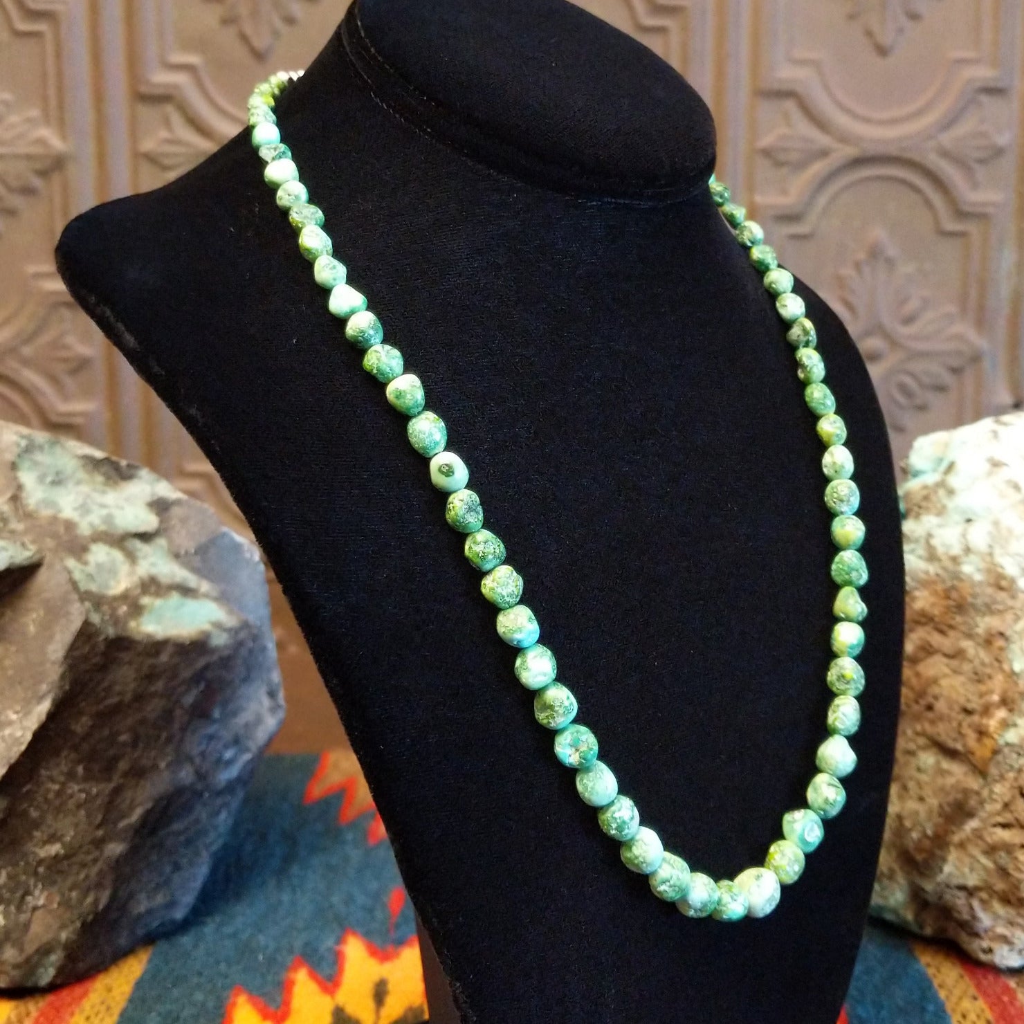 Rough cut Sonoran Gold turquoise beaded along the sterling silver chain of the necklace.