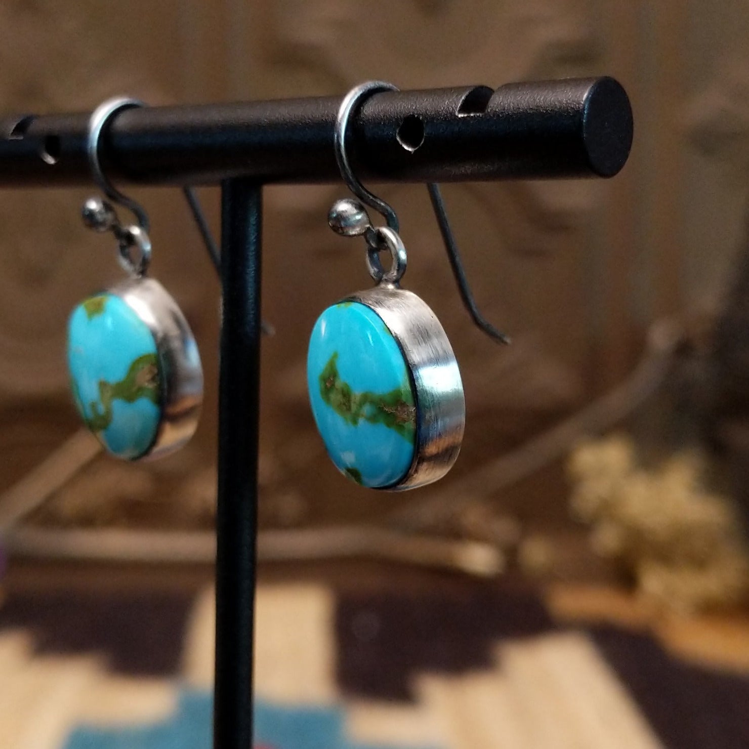 Sterling silver earrings with Sonoran gold turquoise set in round bezels.