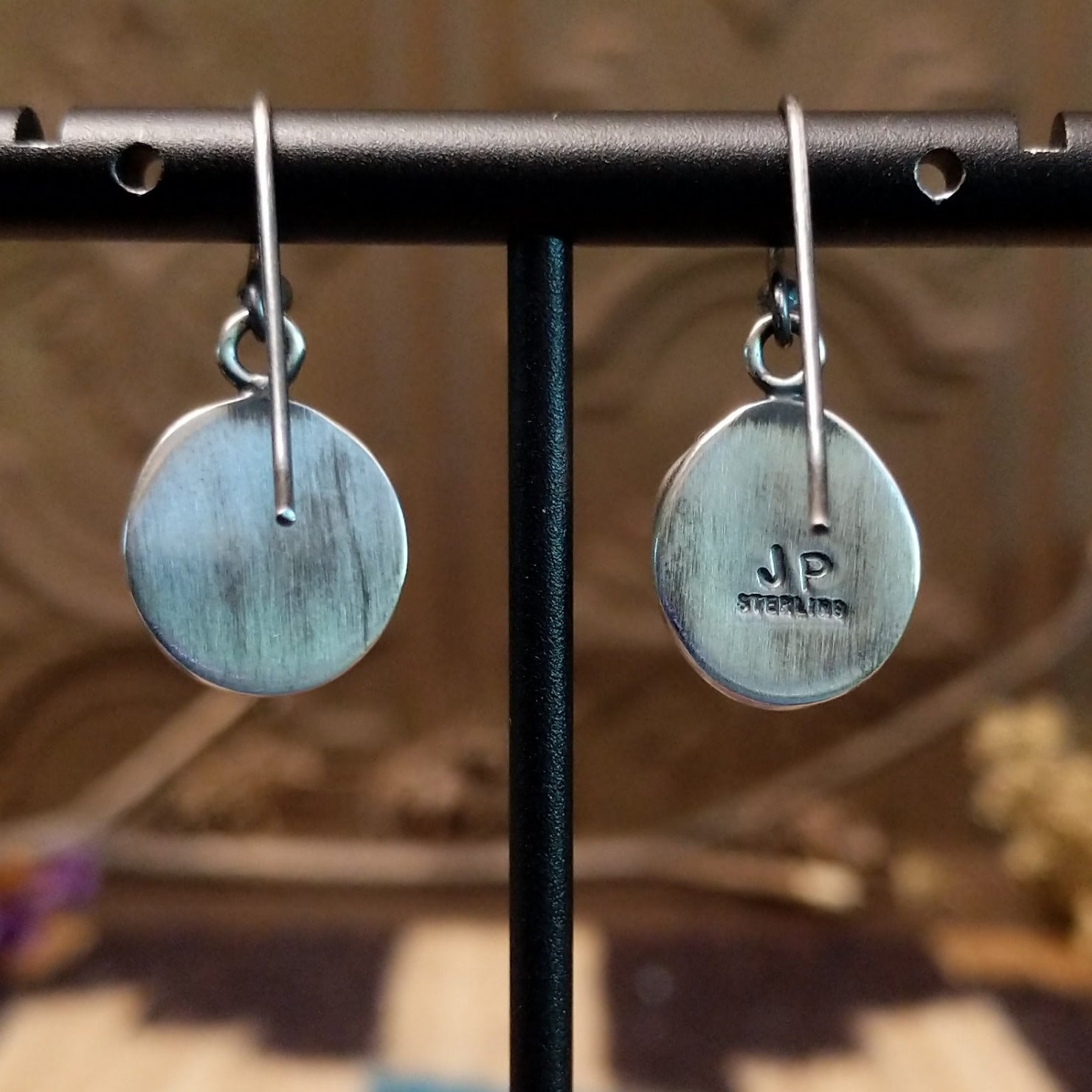 Close-up of the artisan's stamped signature.