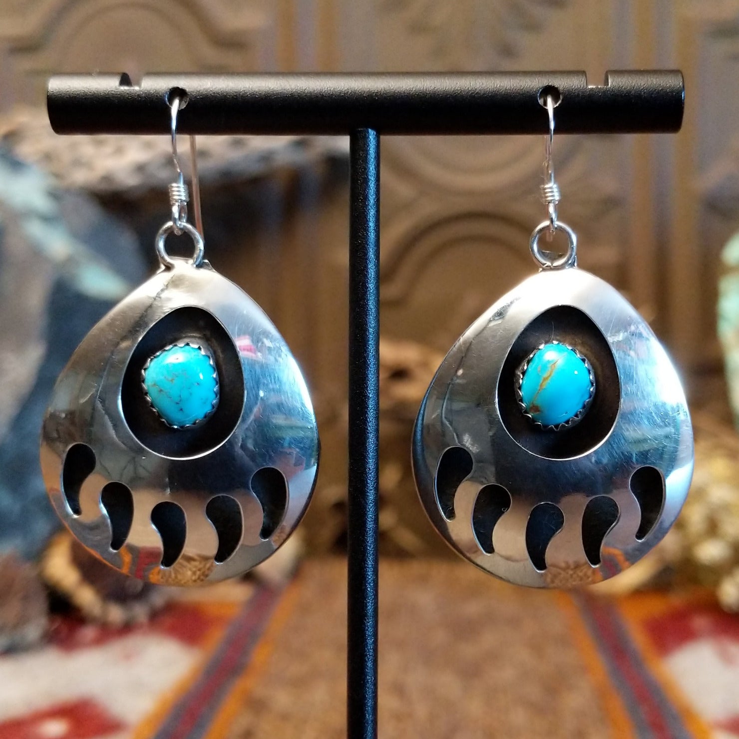 Sterling silver shadowbox bear paw earrings with turquoise set in notched bezels.