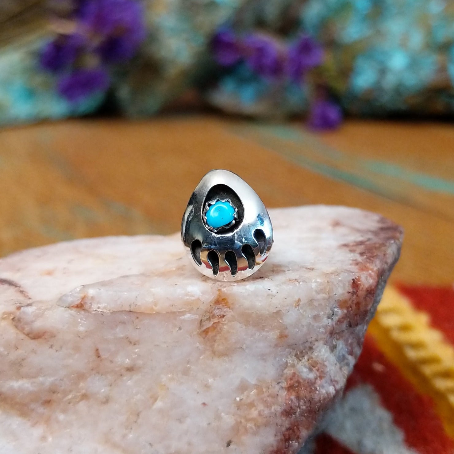 Sterling silver Navajo bear paw tie tack with turquoise center stone.
