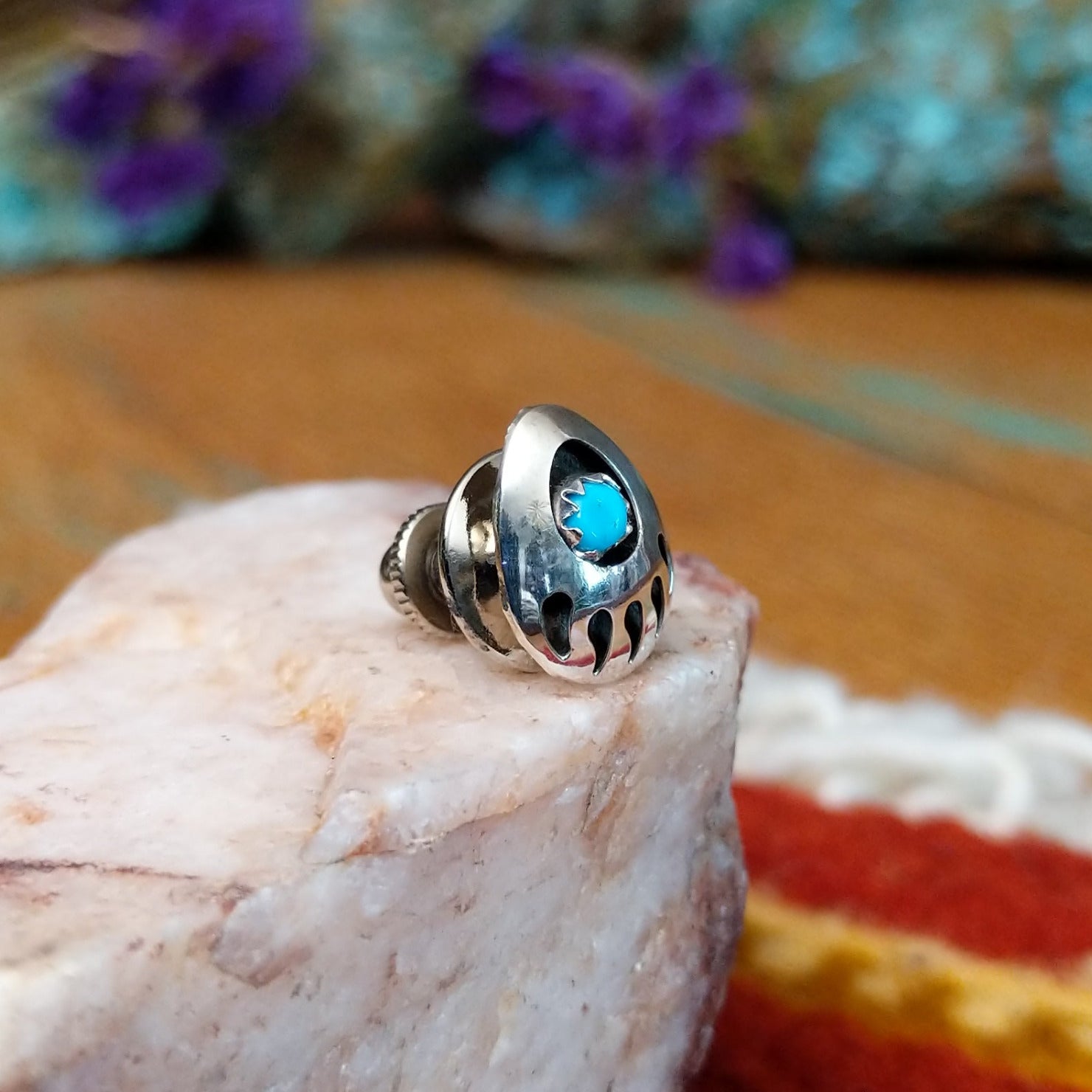 Sterling silver Navajo bear paw tie tack with turquoise center stone.