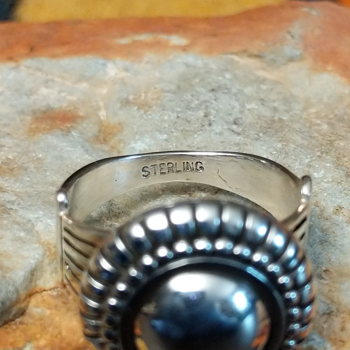 Authentic Navajo sterling silver dome ring with polished curved design. Features elegant silhouette suitable for everyday wear or special occasions. Size 8.5, measures approximately 0.75" L x 0.875" W, weighs approximately 0.2 oz; Sterling Silver.