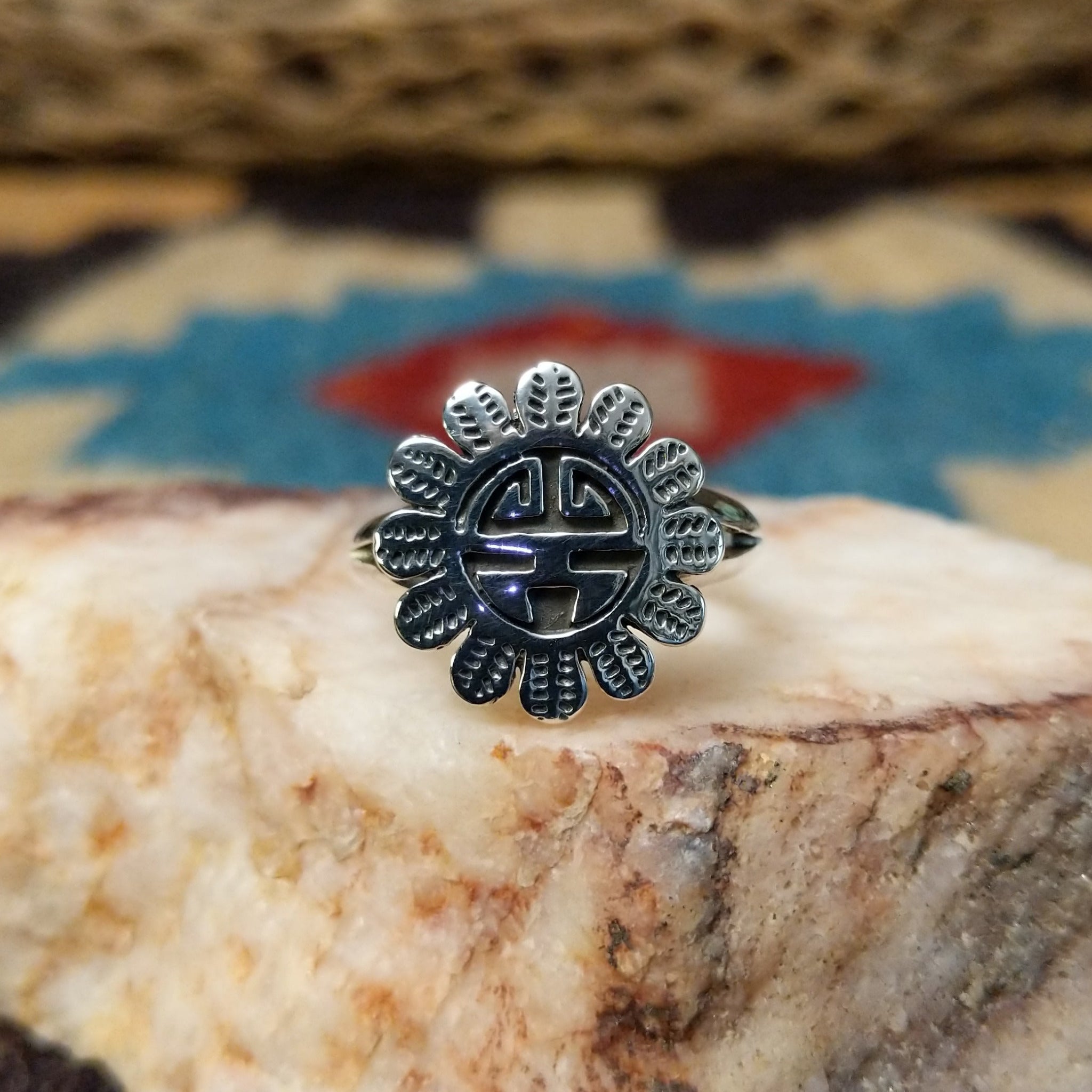 Navajo silver Sunface ring, featuring a handcrafted sterling silver Sunface design with intricate detailing and traditional Southwestern craftsmanship.