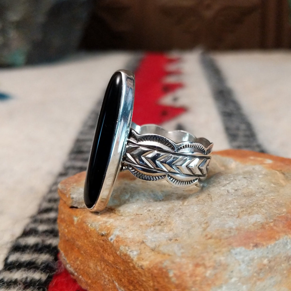 Navajo silver ring with long black onyx and detailed silver band.