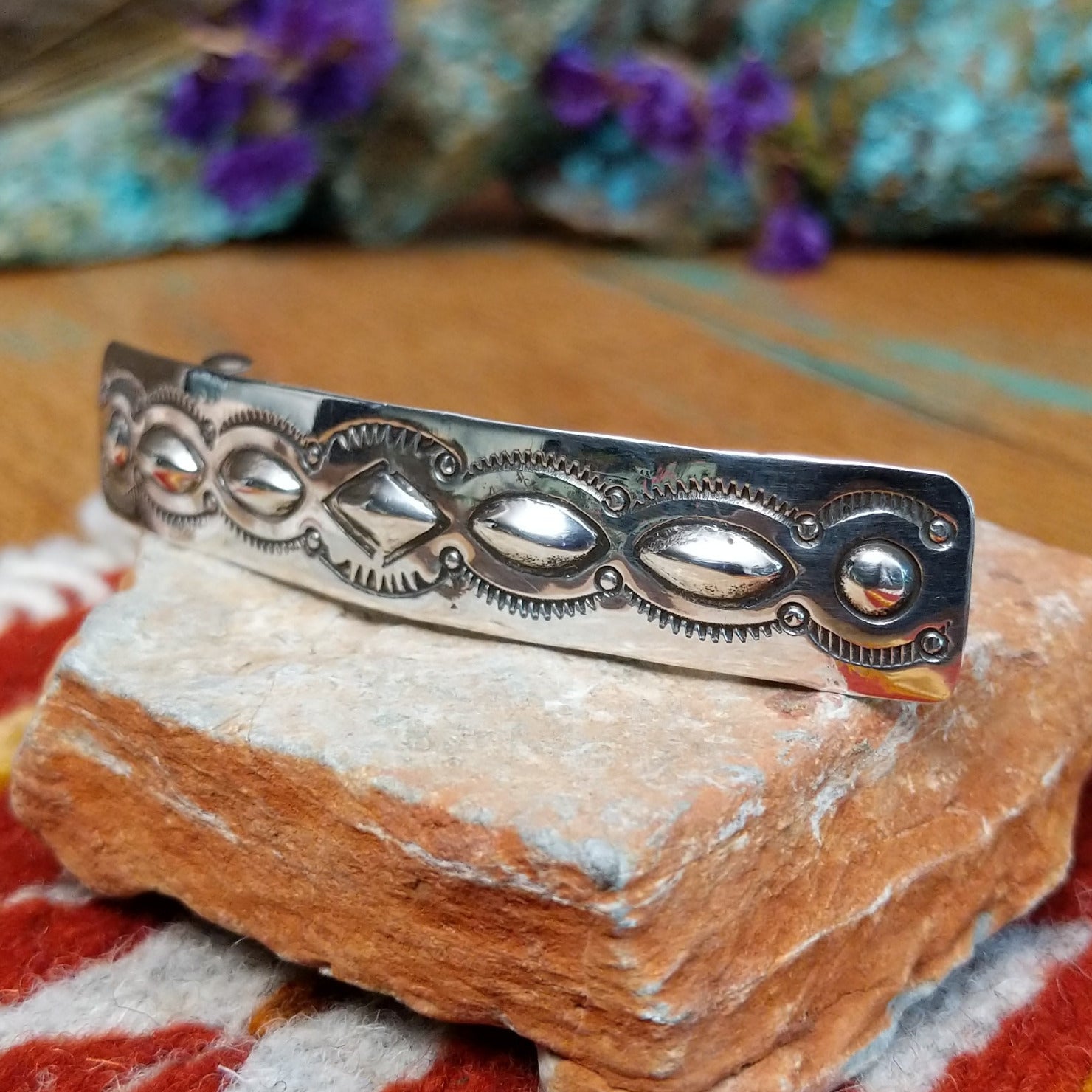 Sterling silver Navajo slim barrette with stamped oval silverwork design.