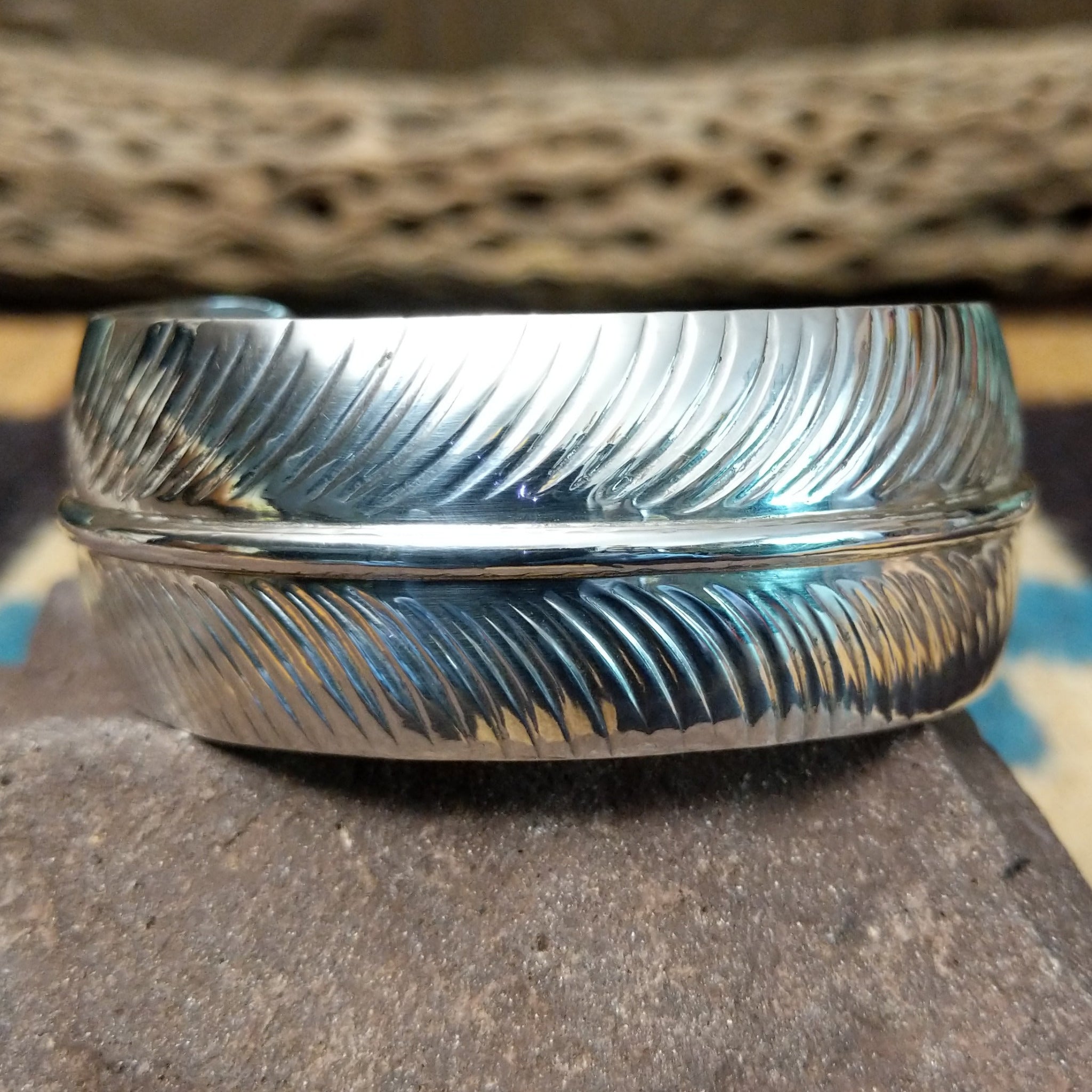 Navajo smooth silver feather cuff by A.D., featuring a handcrafted sterling silver feather design with polished contours and traditional Southwestern craftsmanship.