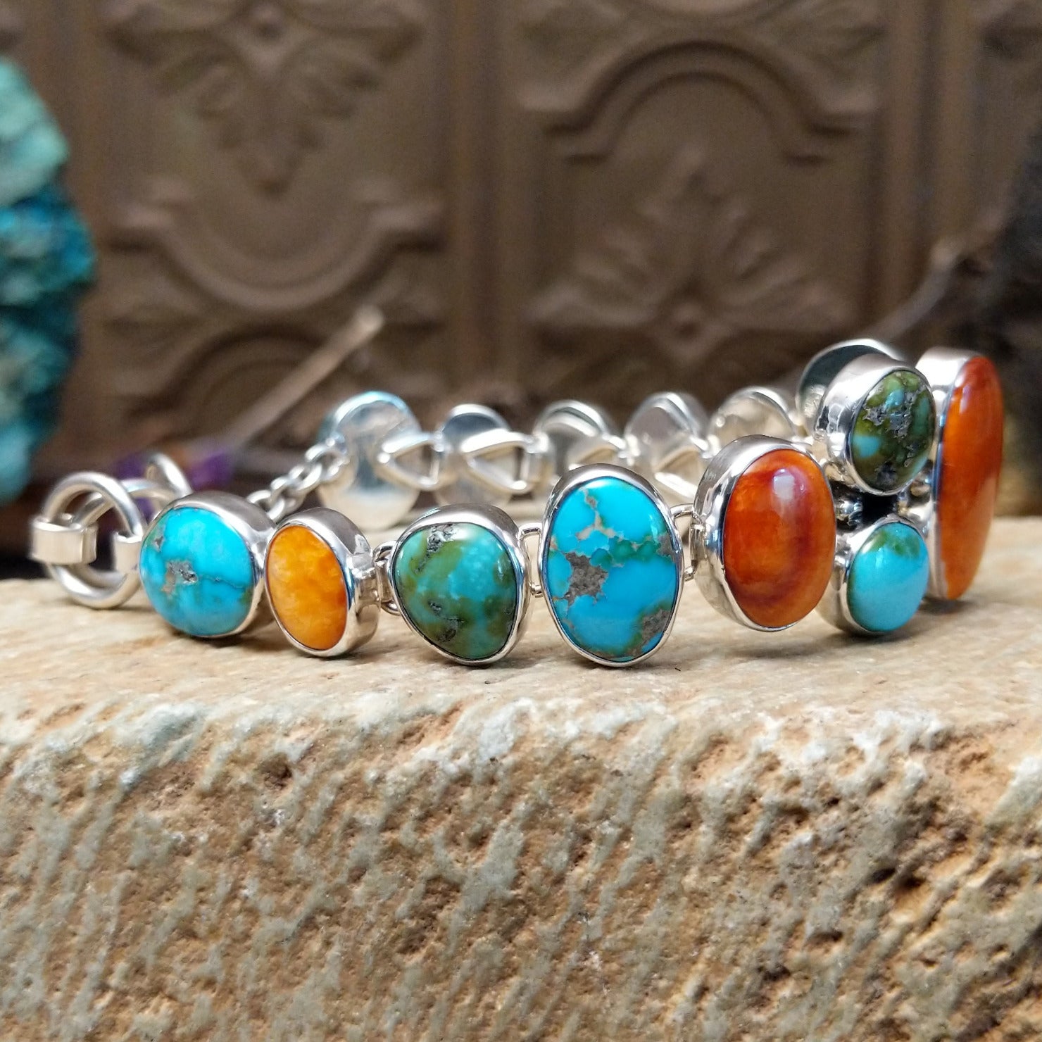 Sterling silver bracelet with turquoise and orange spiny oyster shell set in multiple bezels.