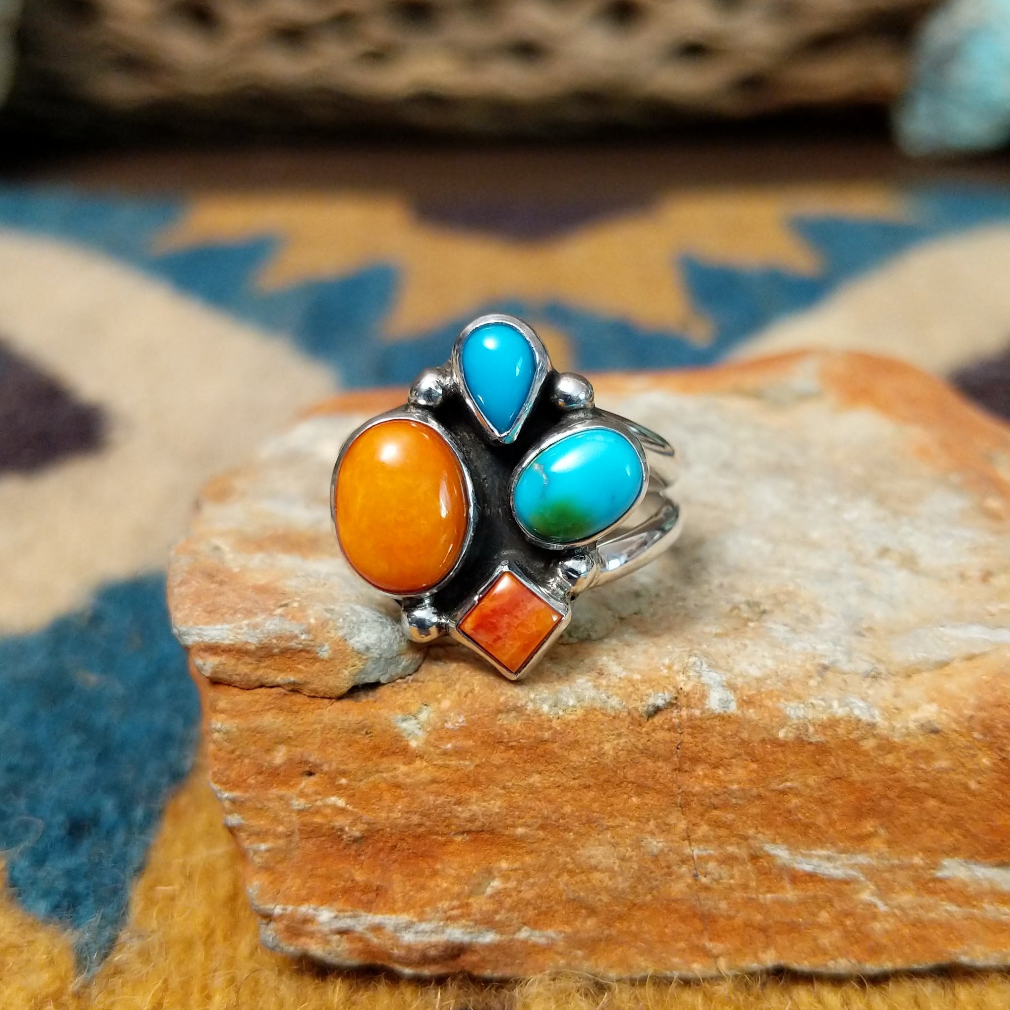 Handcrafted sterling silver Navajo Sonoran Gold turquoise and orange spiny oyster ring, featuring a colorful asymmetrical cluster design.