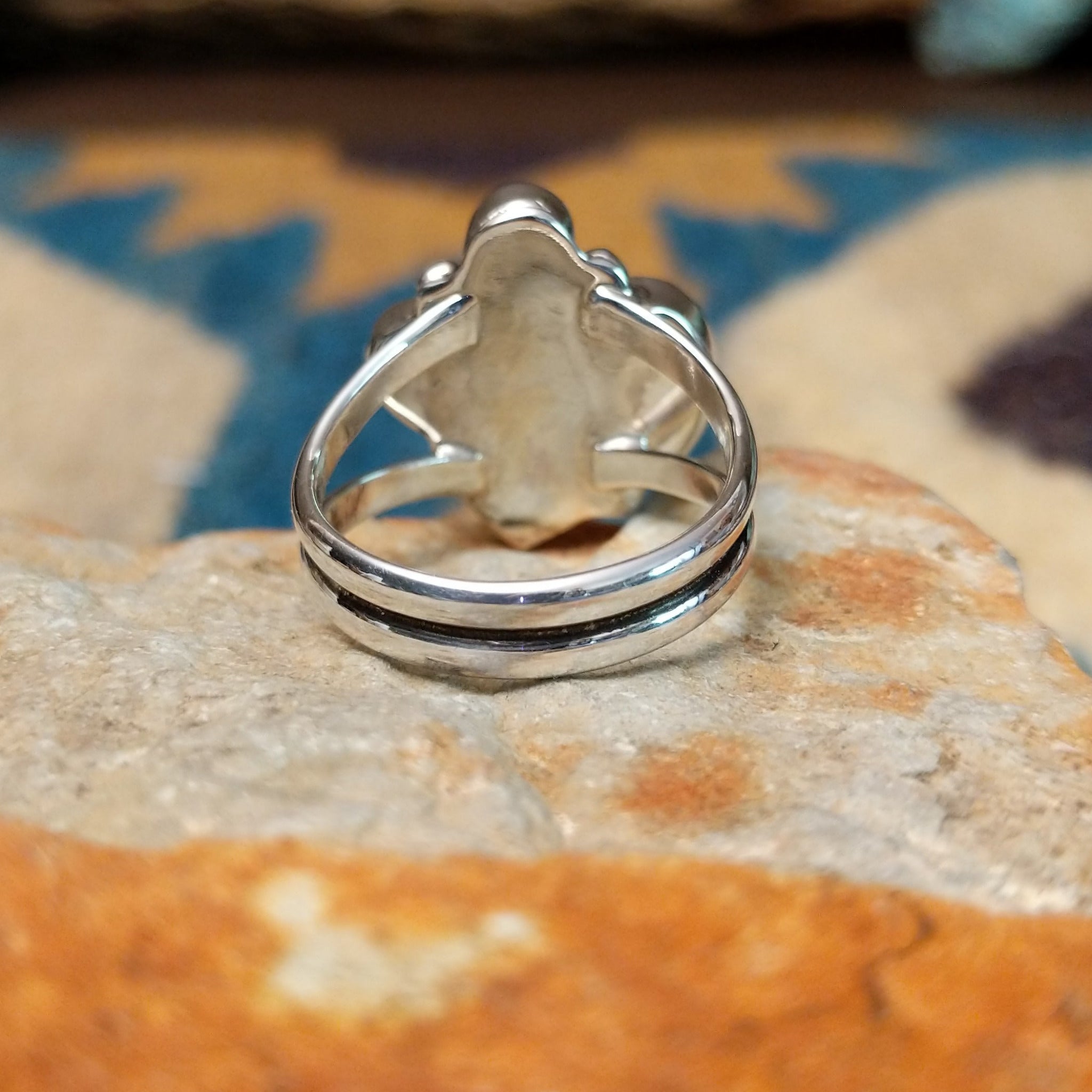 Handcrafted sterling silver Navajo Sonoran Gold turquoise and orange spiny oyster ring, featuring a colorful asymmetrical cluster design; underside view.