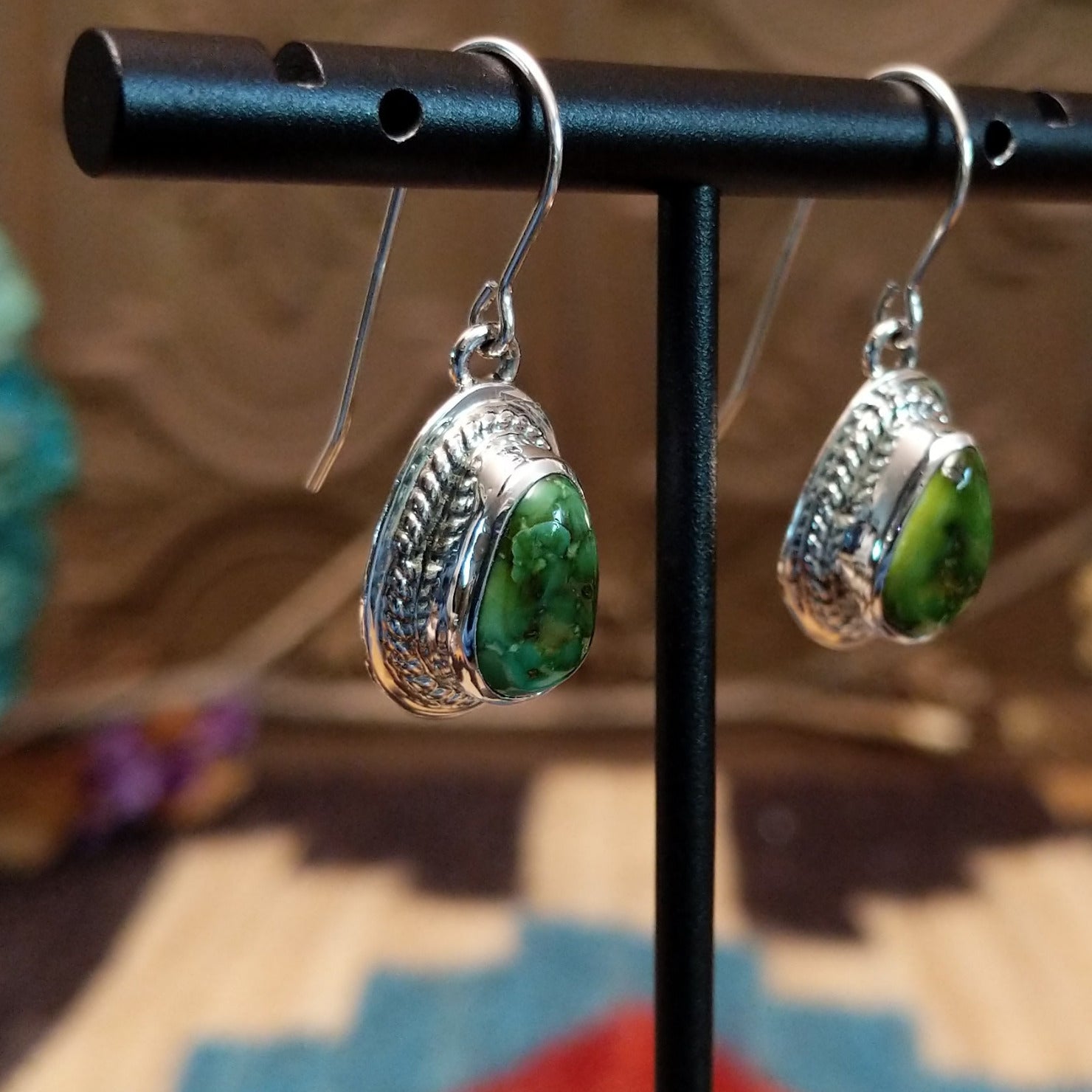 Sterling silver earrings with Sonoran gold turquoise set in teardrop bezels, framed by twisted rope accents.