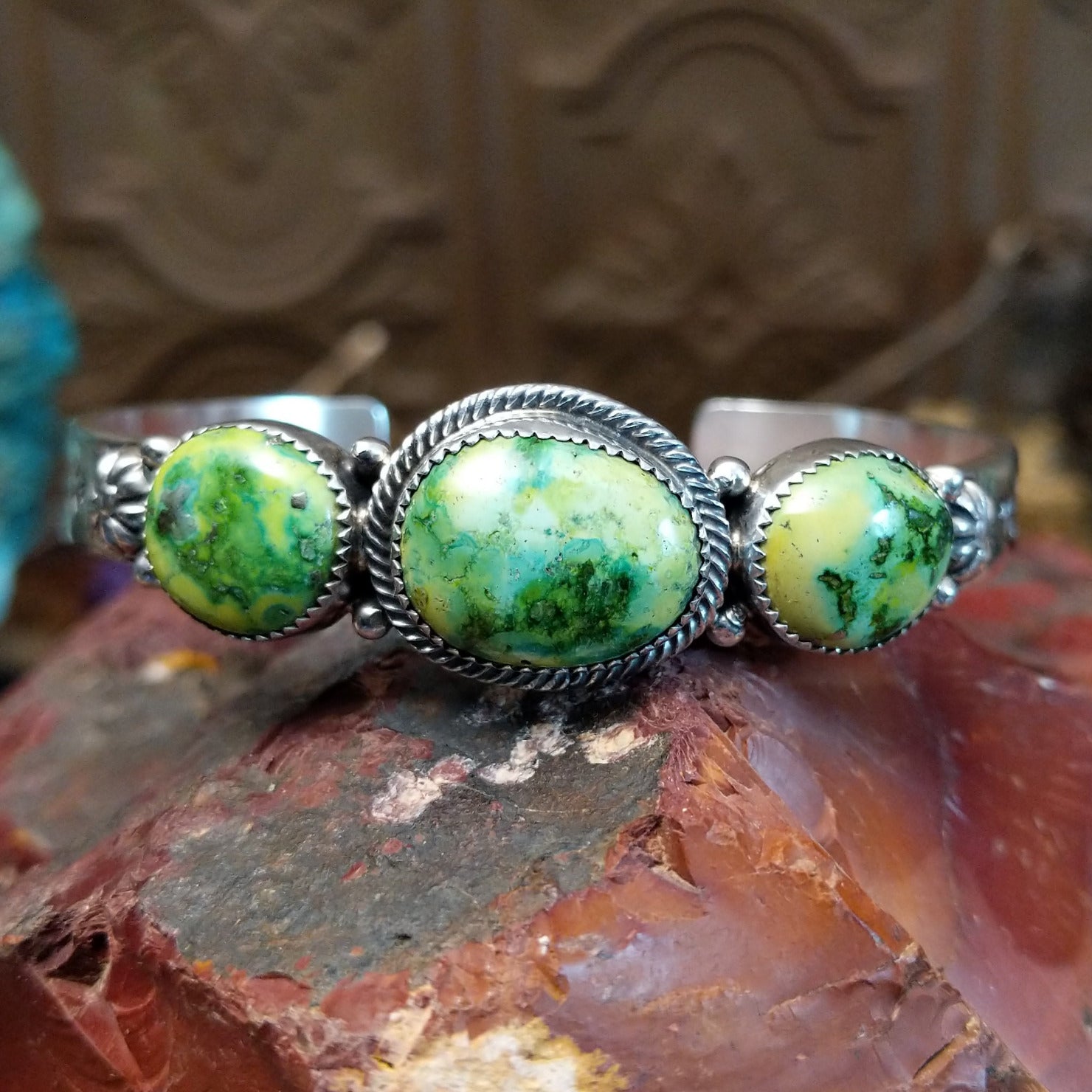 Sterling silver cuff with Sonoran gold turquoise set in oval bezels, framed by twisted rope and dotted accents.