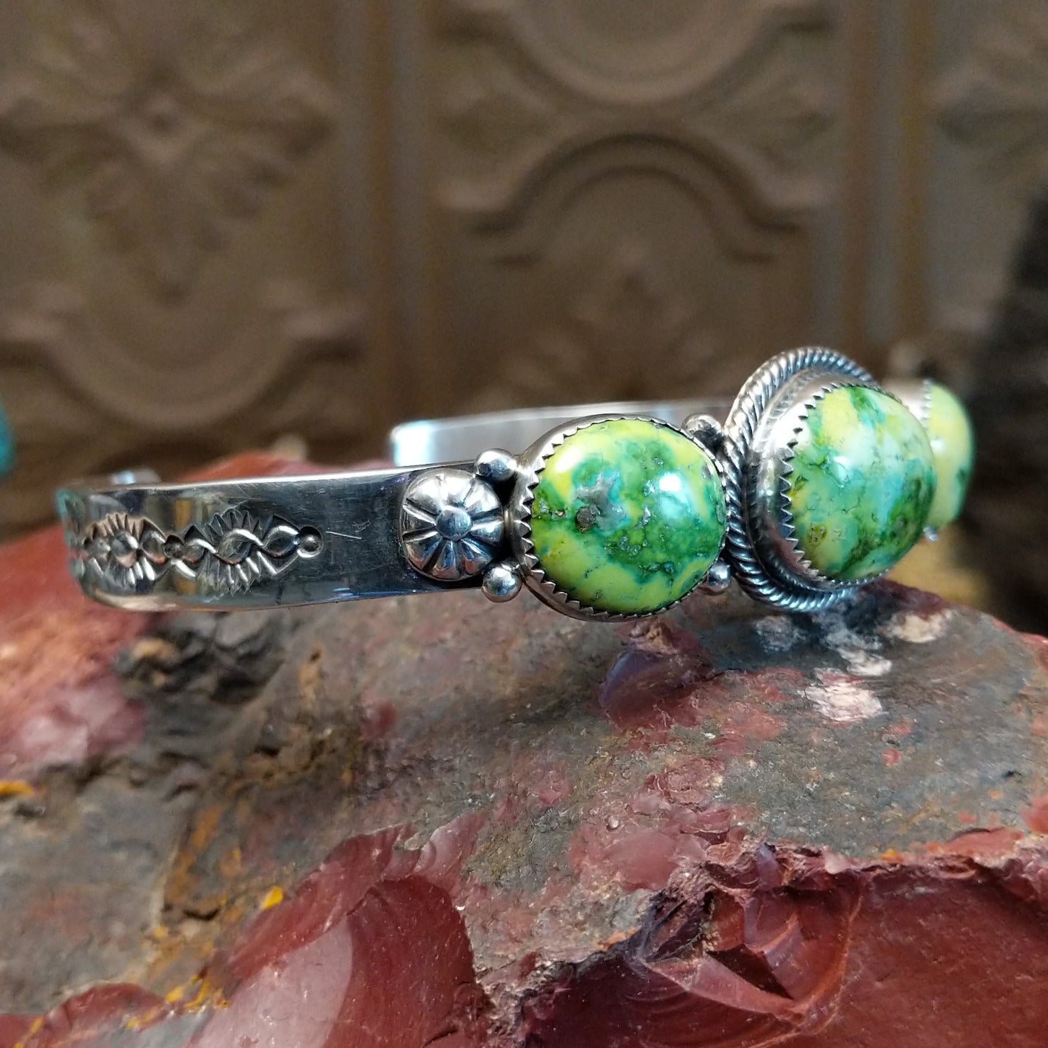Sterling silver cuff with Sonoran gold turquoise set in oval bezels, framed by twisted rope and dotted accents.