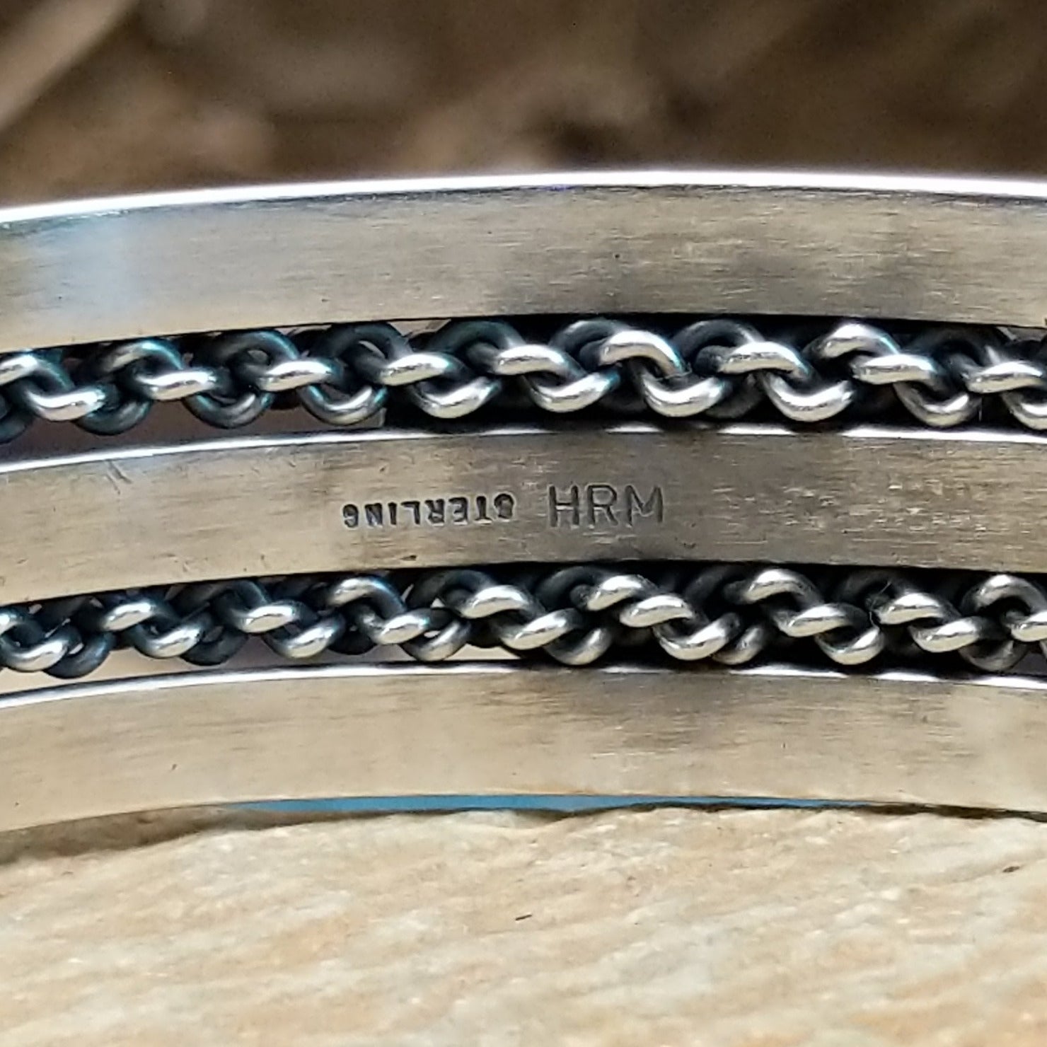 Close-up of the artisan's stamped signature.