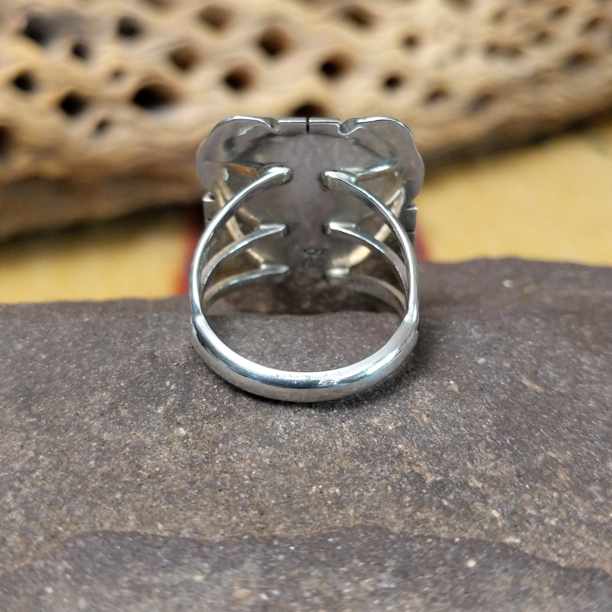 Navajo square black onyx ring, featuring a polished square black onyx stone set in handcrafted sterling silver with traditional Southwestern-inspired metalwork. Underside view.