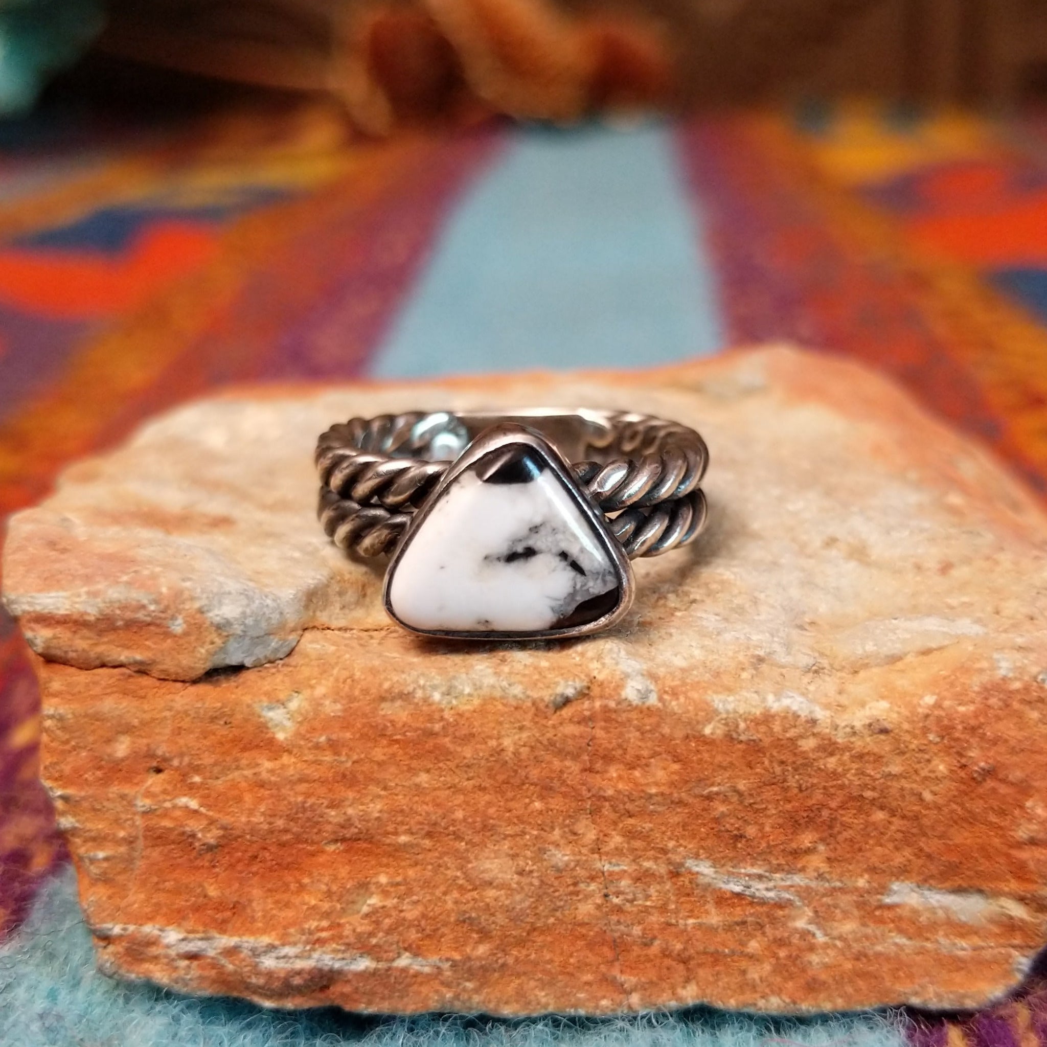 Navajo silver ring with triangular White Buffalo stone and double twisted band.