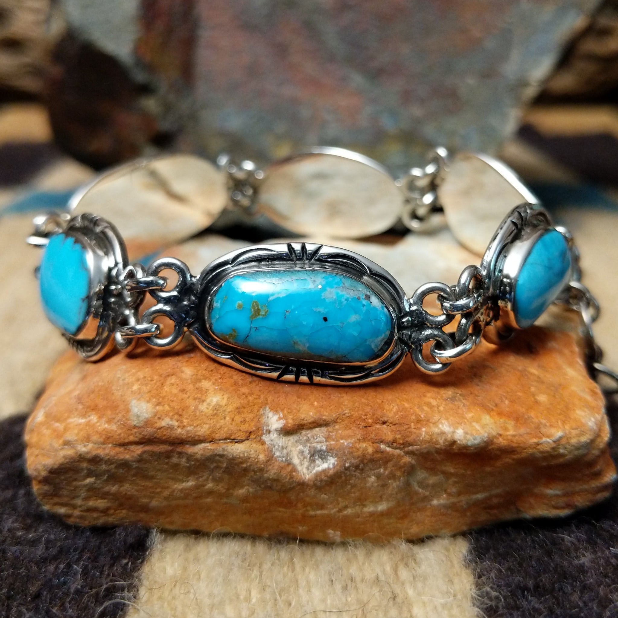 Navajo turquoise link bracelet by A.P. with natural turquoise stones set in handcrafted sterling silver.