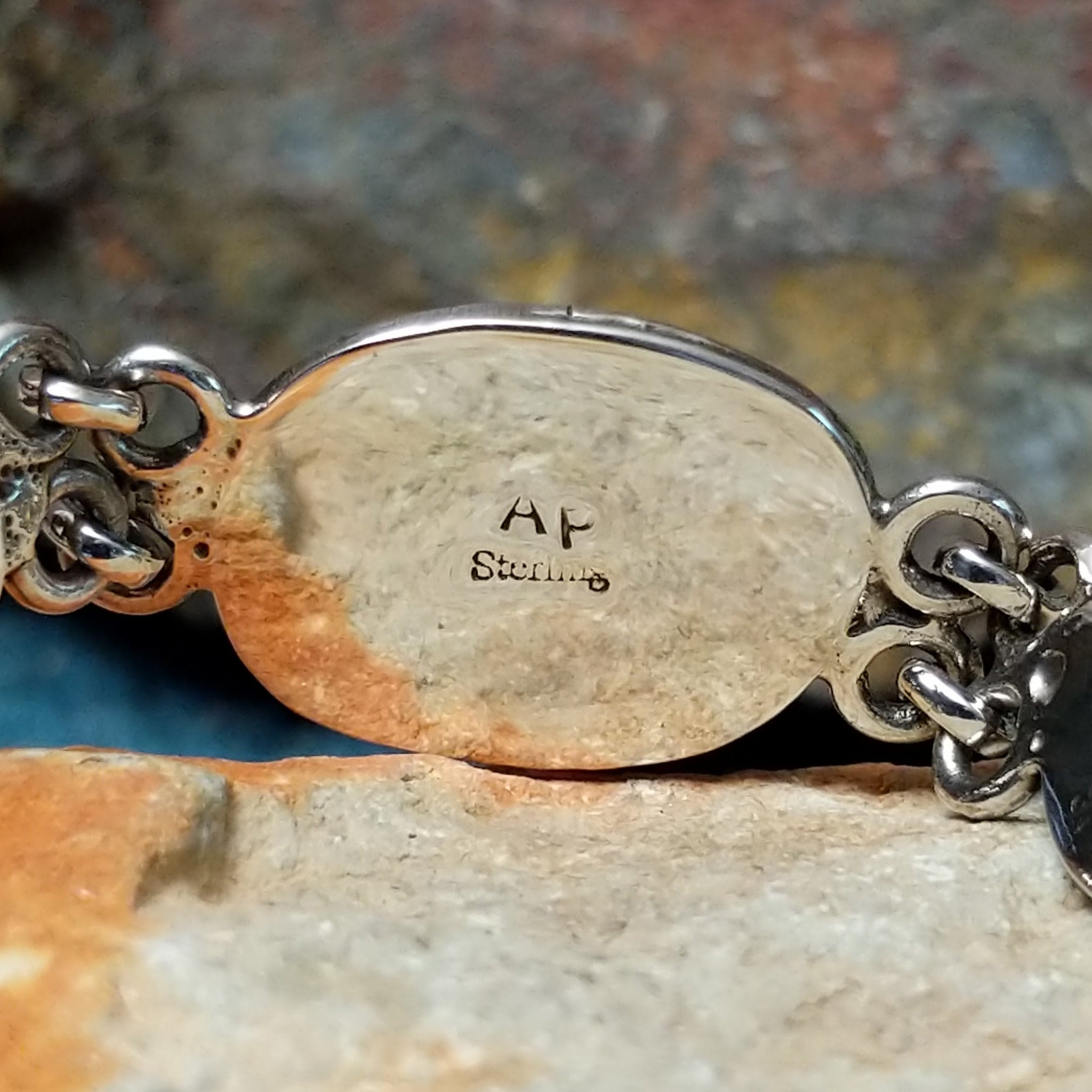 Navajo turquoise link bracelet by A.P. with natural turquoise stones set in handcrafted sterling silver; artisan and Sterling Silver stamp.