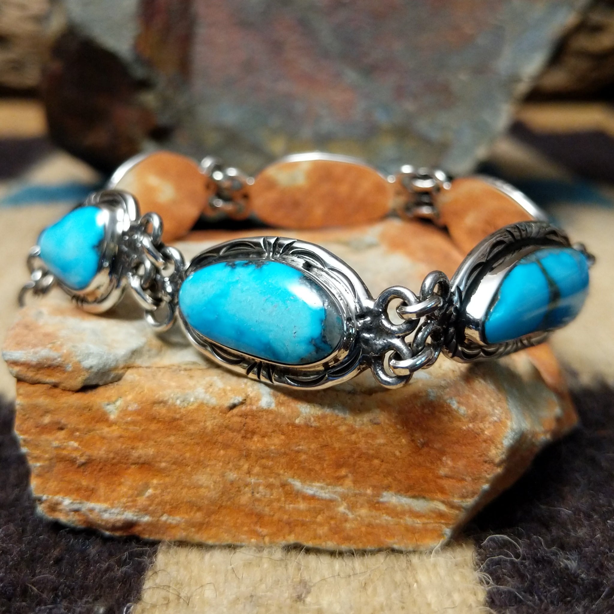 Navajo turquoise link bracelet by A.P. with natural turquoise stones set in handcrafted sterling silver.
