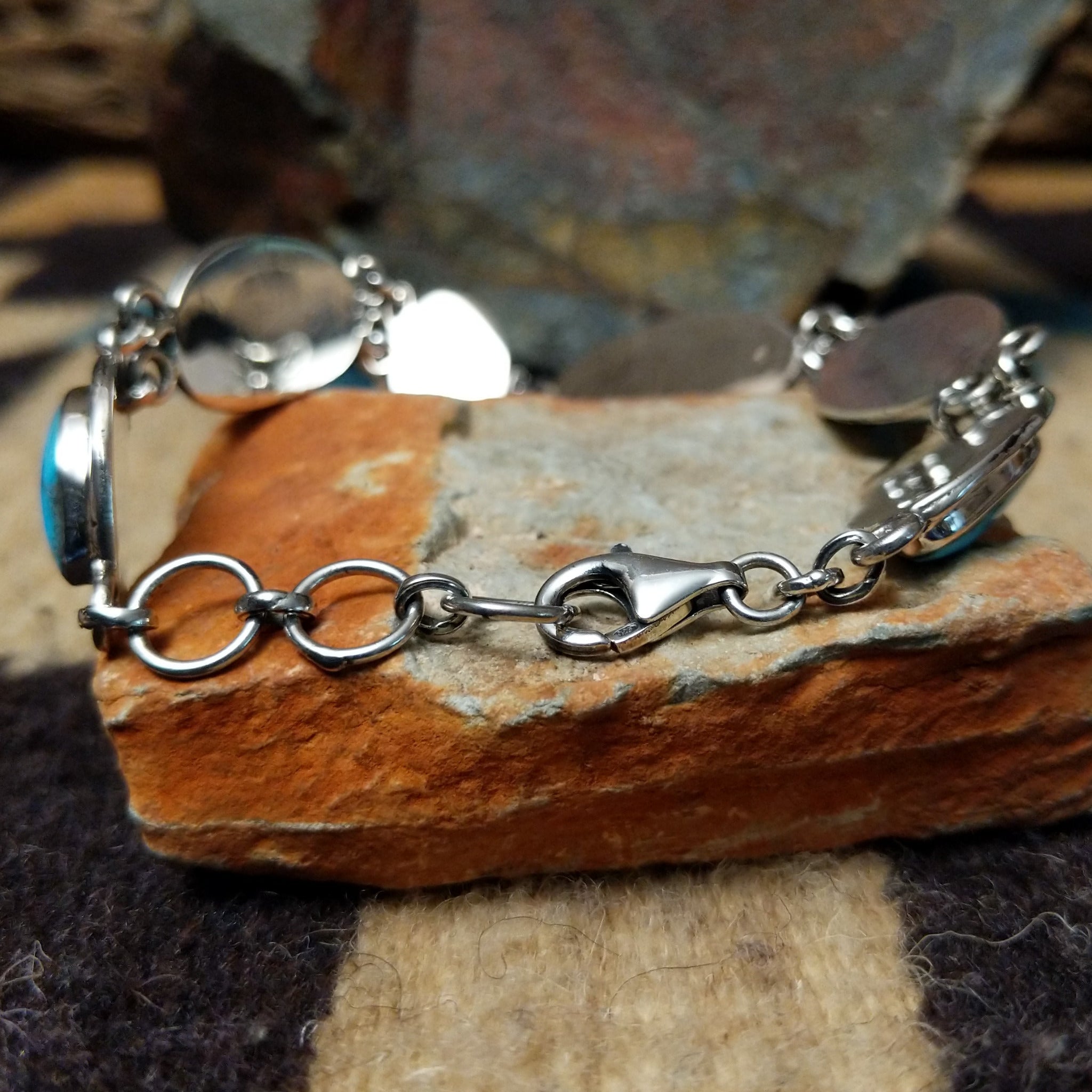 Navajo turquoise link bracelet by A.P. with natural turquoise stones set in handcrafted sterling silver; clasp view.