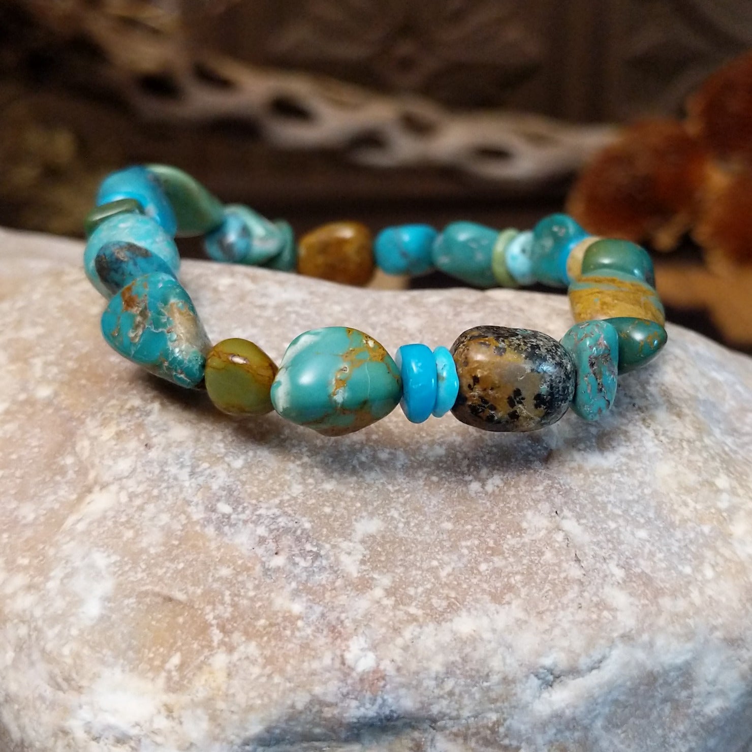 Bracelet with turquoise beaded along the elastic band.