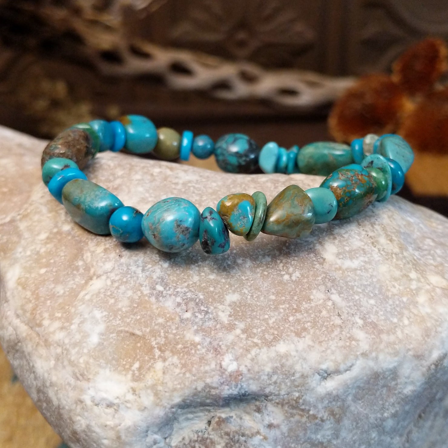 Bracelet with turquoise beaded along the elastic band.