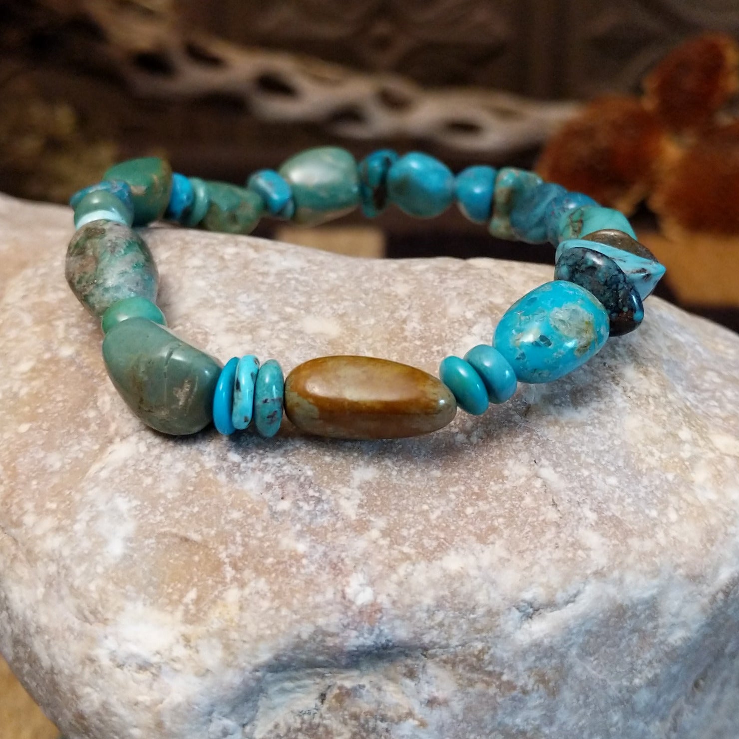 Bracelet with turquoise beaded along the elastic band.
