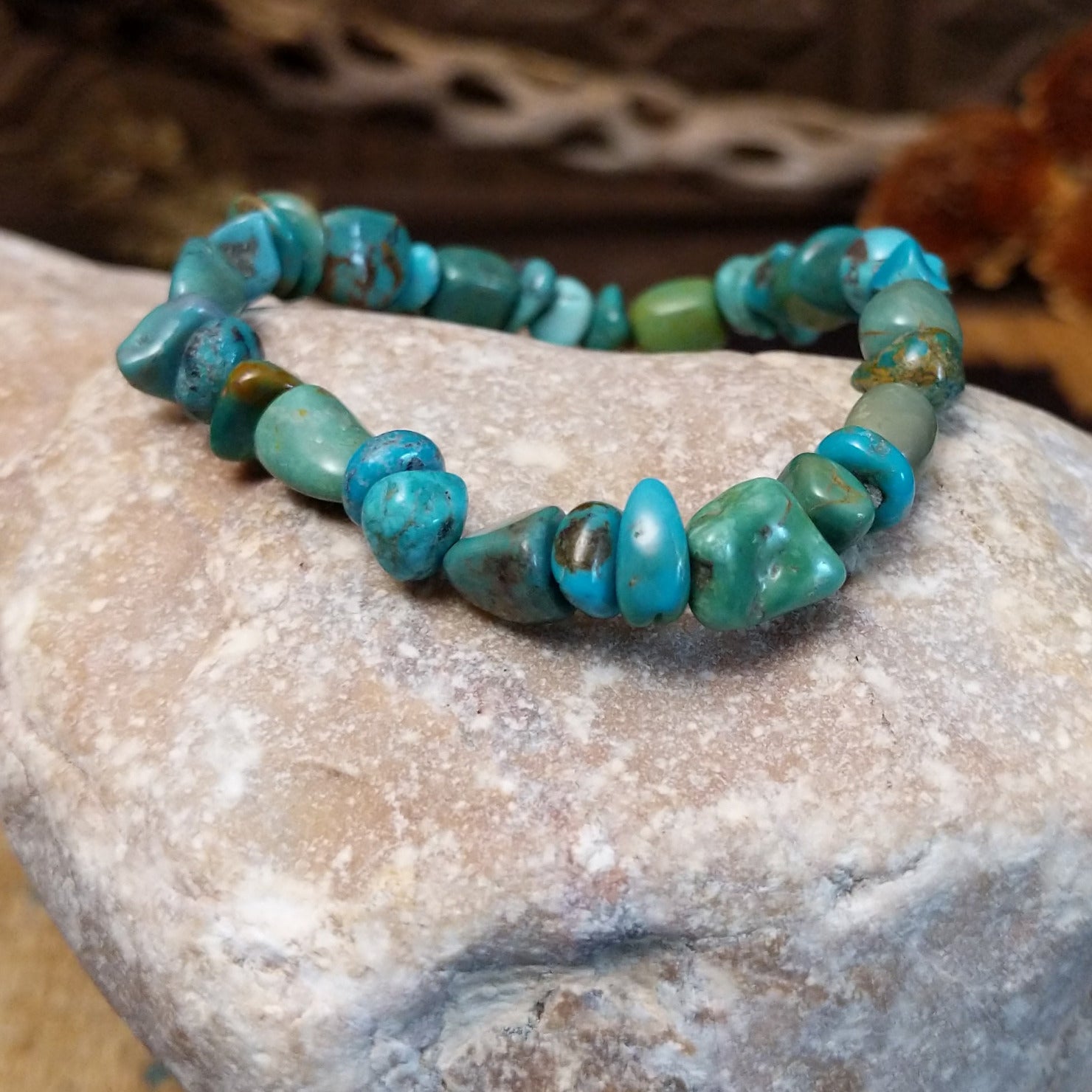 Bracelet with turquoise beaded along the elastic band.