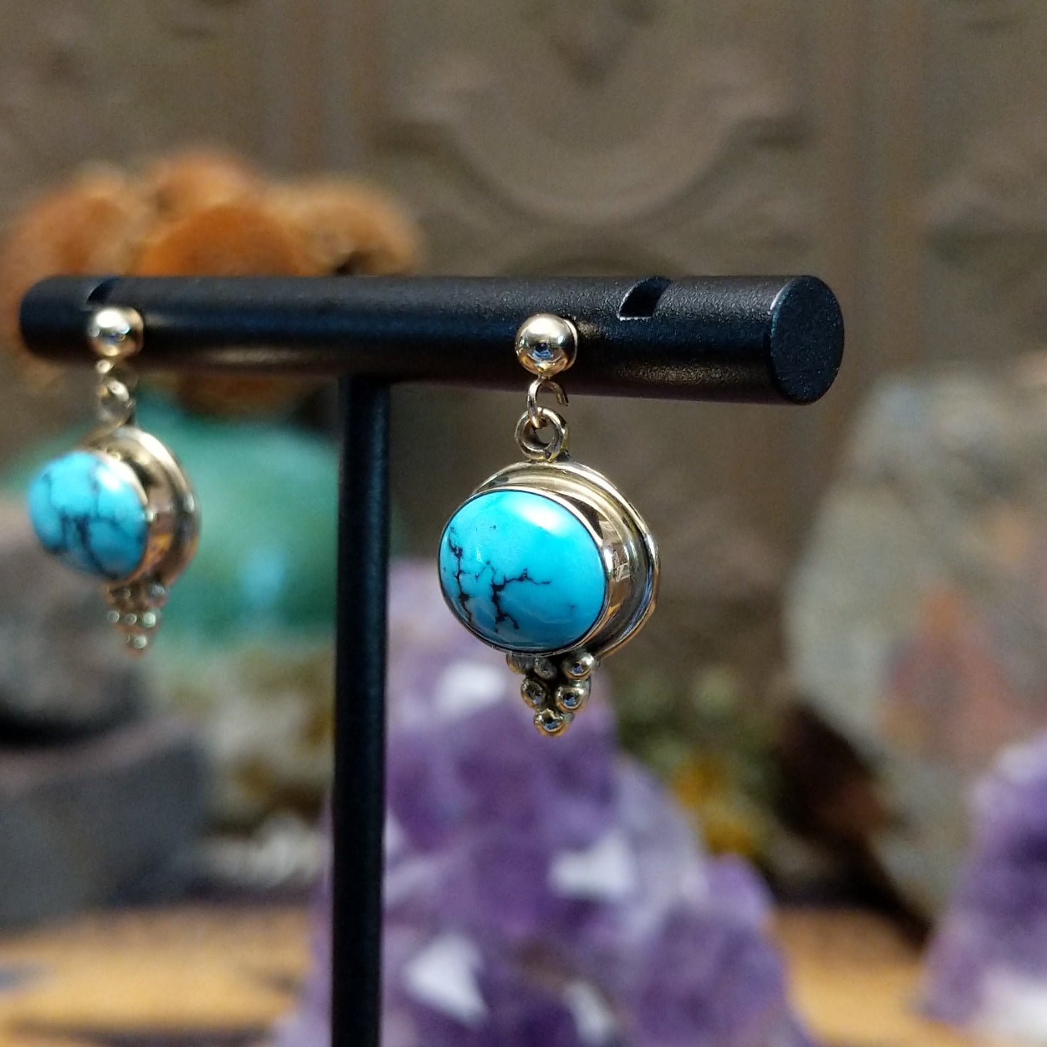 14kt gold Navajo earrings with oval turquoise and gold bead accents.