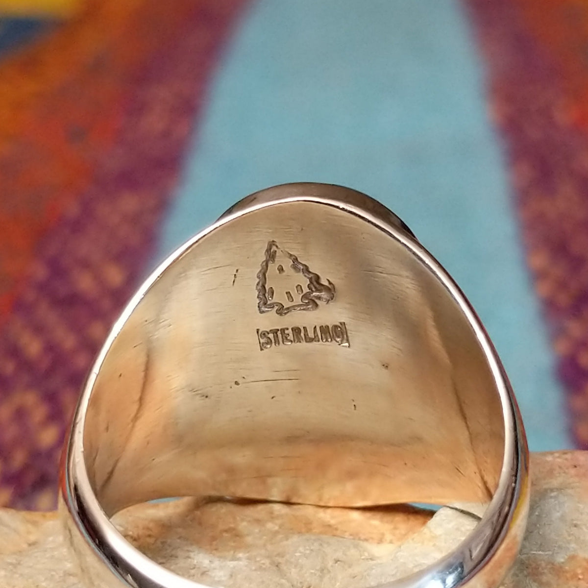 Navajo Turquoise Mosaic Ring featuring an oval face filled with geometric turquoise pieces in blue, aqua, sage, and green tones, set in a wide polished silver band; artisan and Sterling Silver stamp.