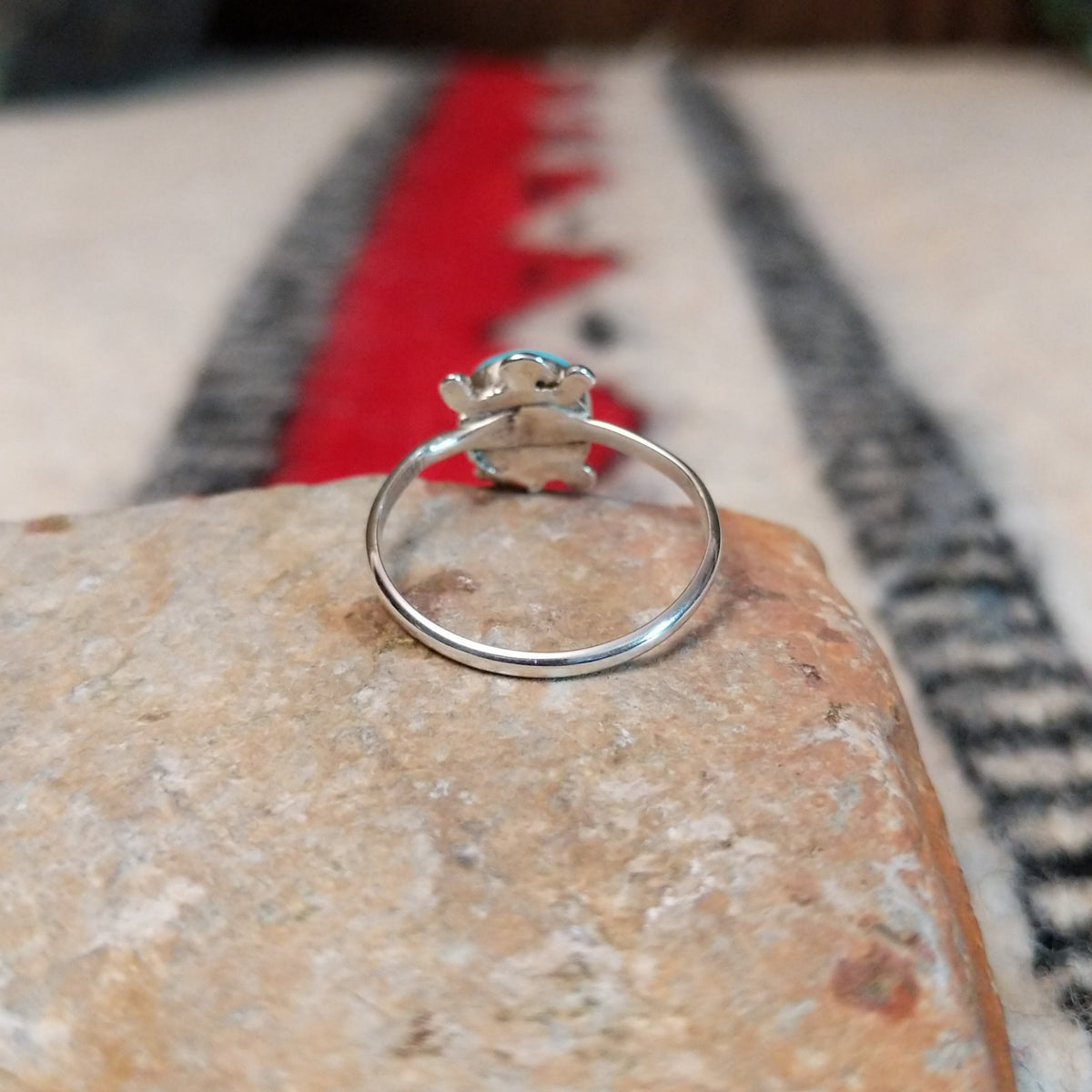 Navajo silver turtle ring with round turquoise stone.