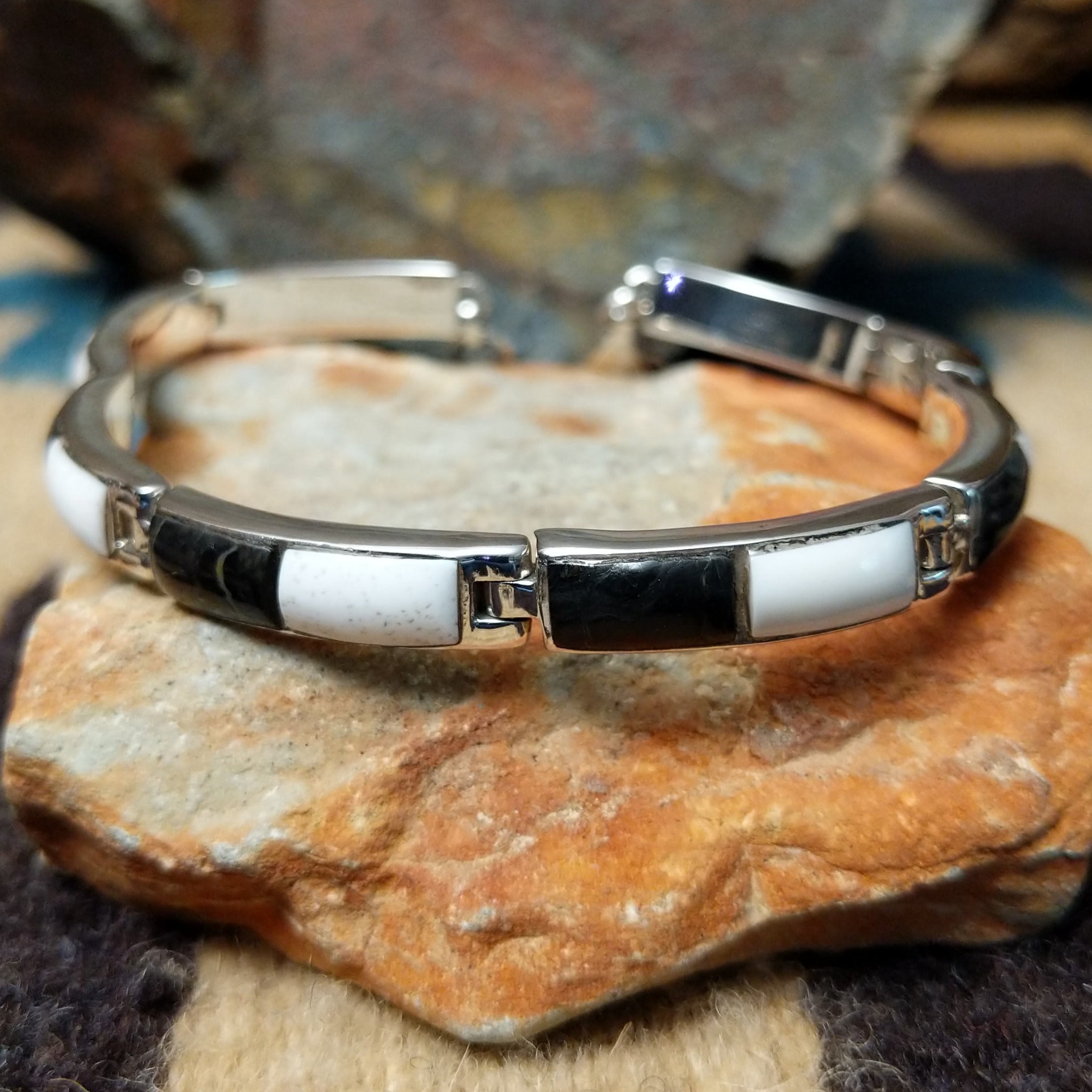 Navajo White Buffalo link bracelet by M.T. with black and white inlay set in sterling silver.