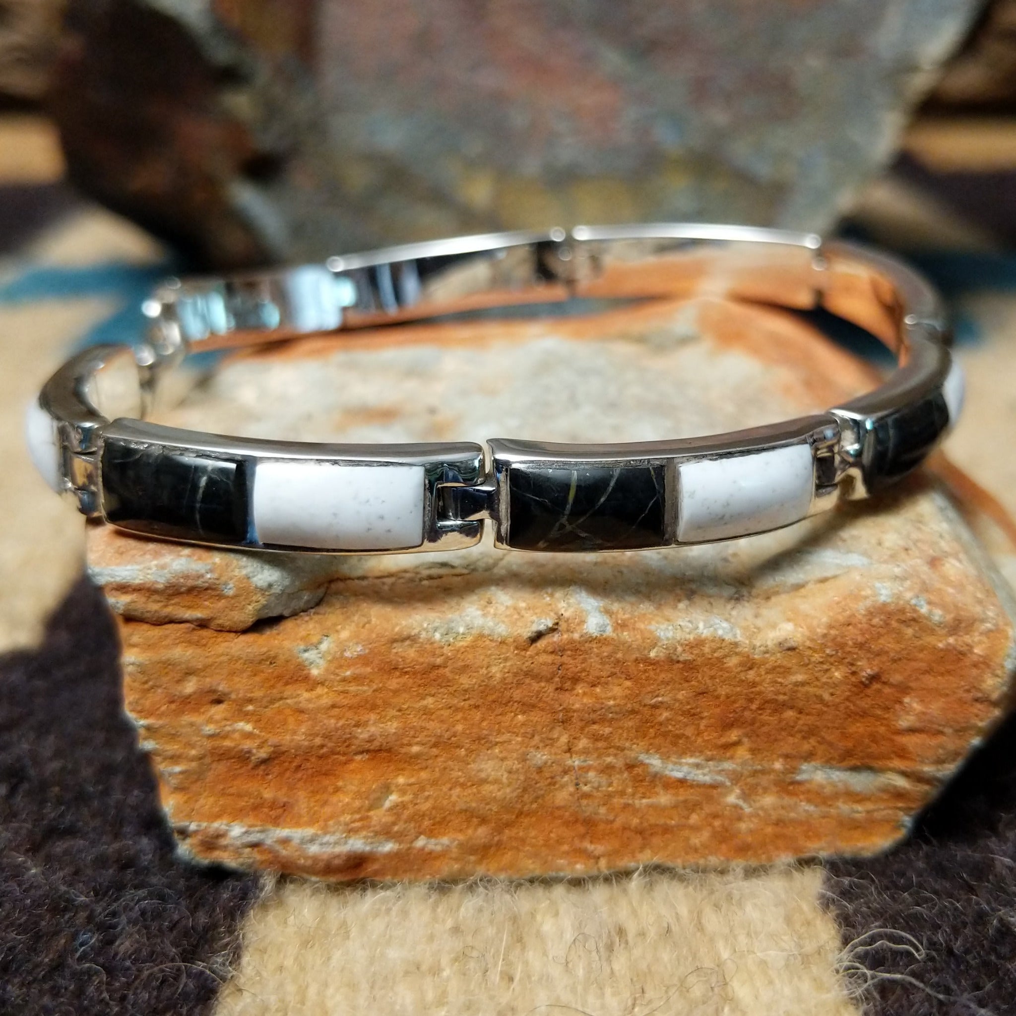 Navajo White Buffalo link bracelet by M.T. with black and white inlay set in sterling silver.