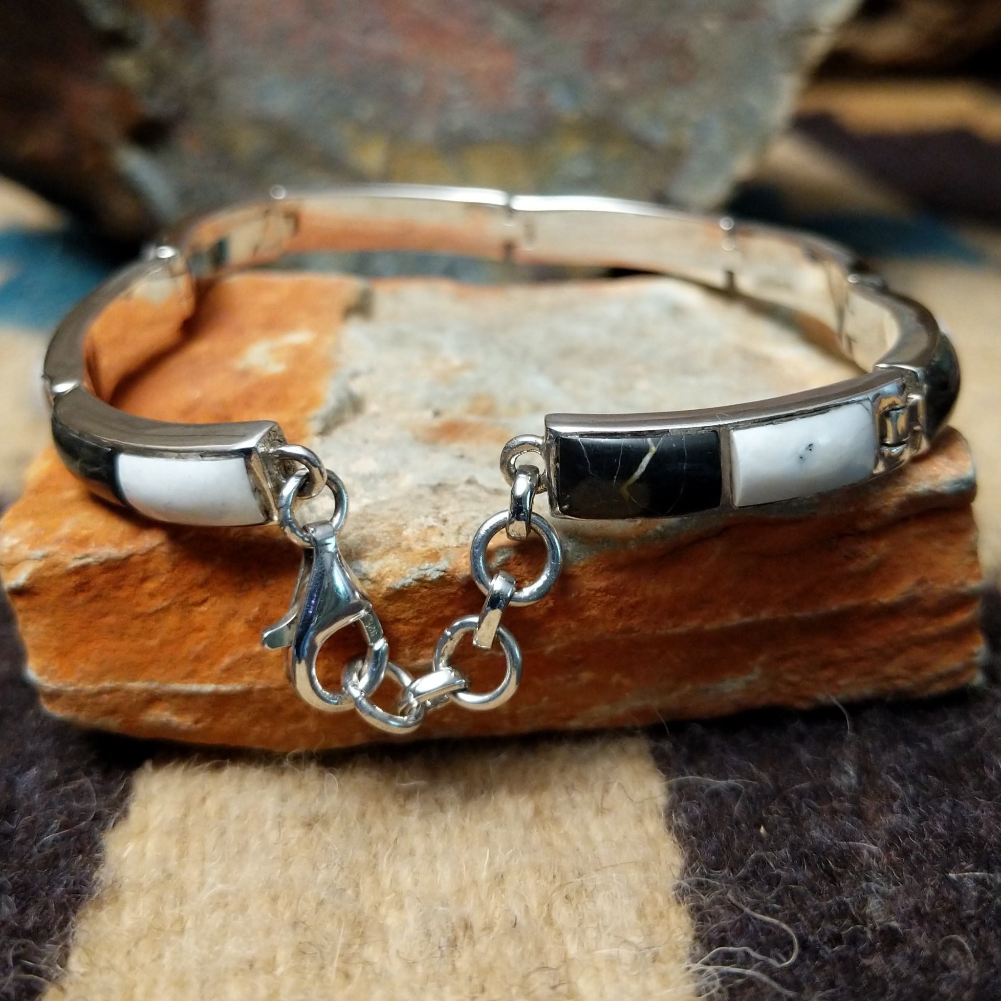 Navajo White Buffalo link bracelet by M.T. with black and white inlay set in sterling silver; underside and clasp view.