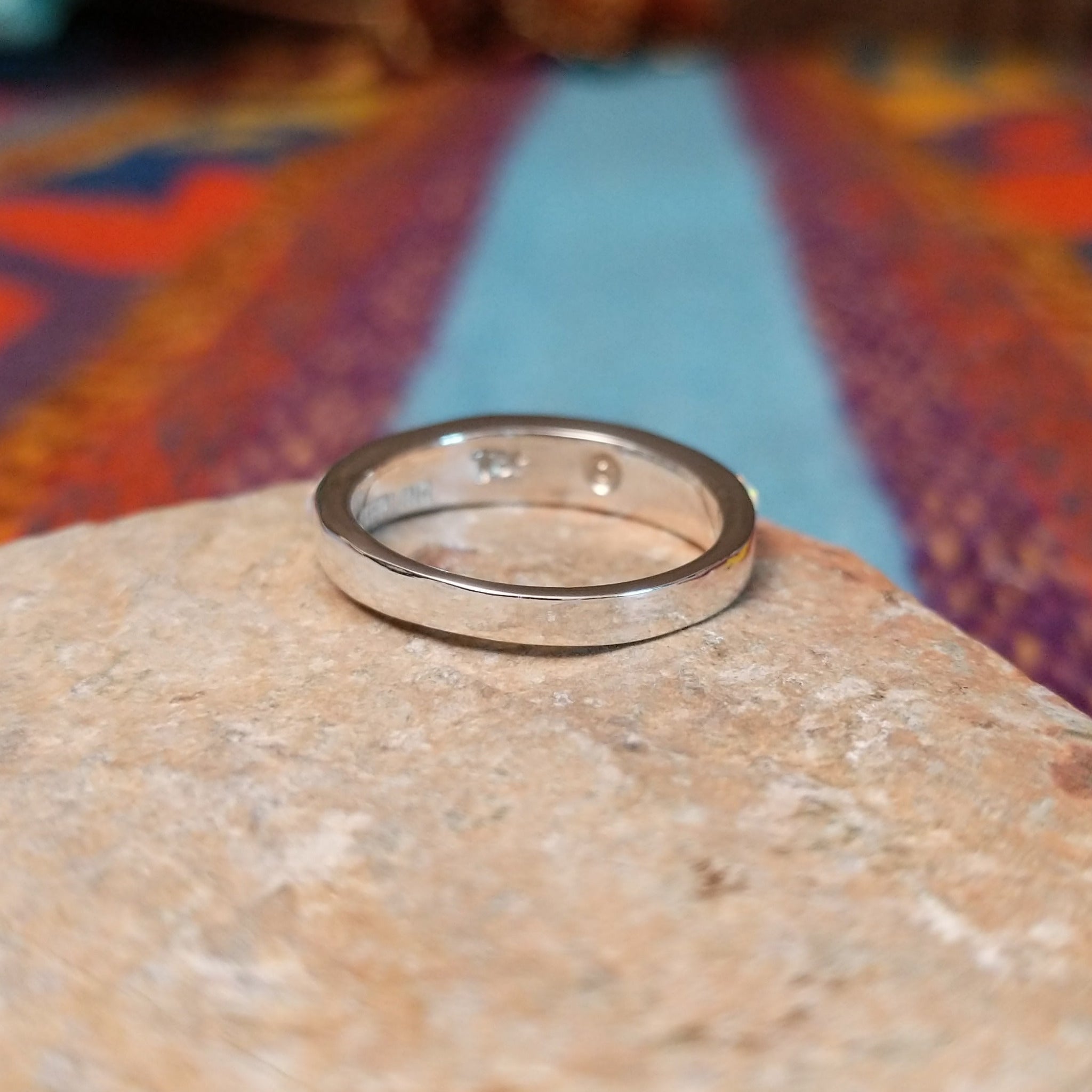 Navajo silver band ring with inlaid white manmade opal inlay.