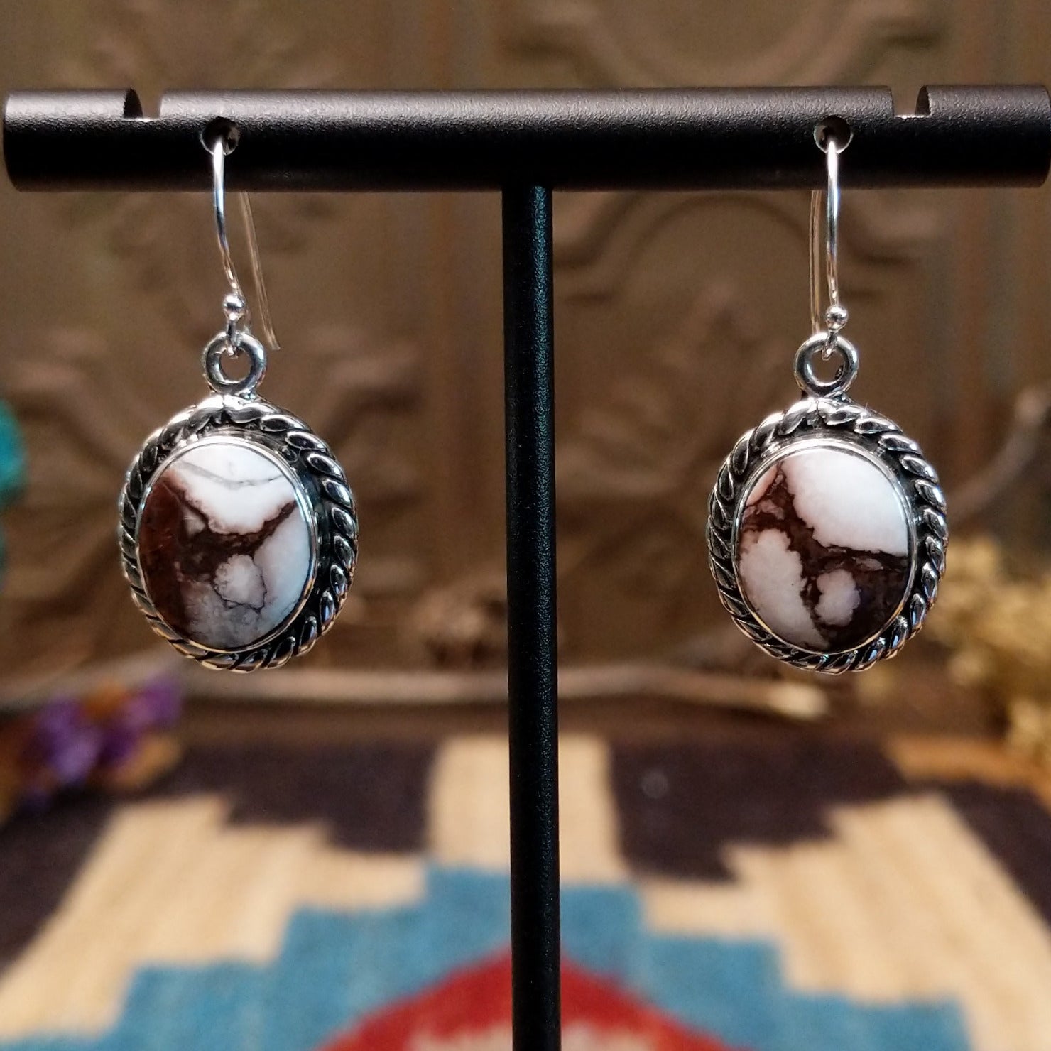 Sterling silver dangle earrings with wild horse stones set in the bezels, framed by twisted rope accents.