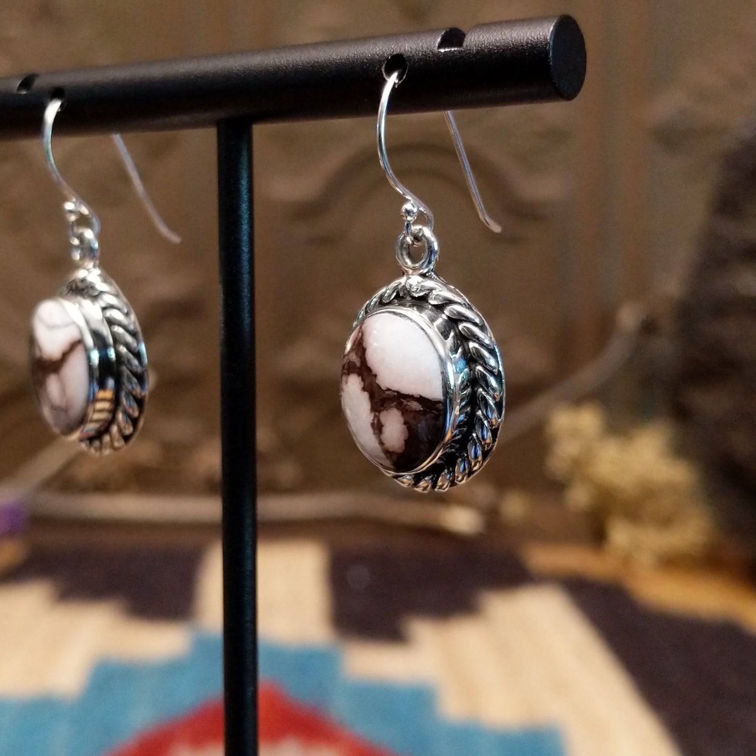 Sterling silver dangle earrings with wild horse stones set in the bezels, framed by twisted rope accents.