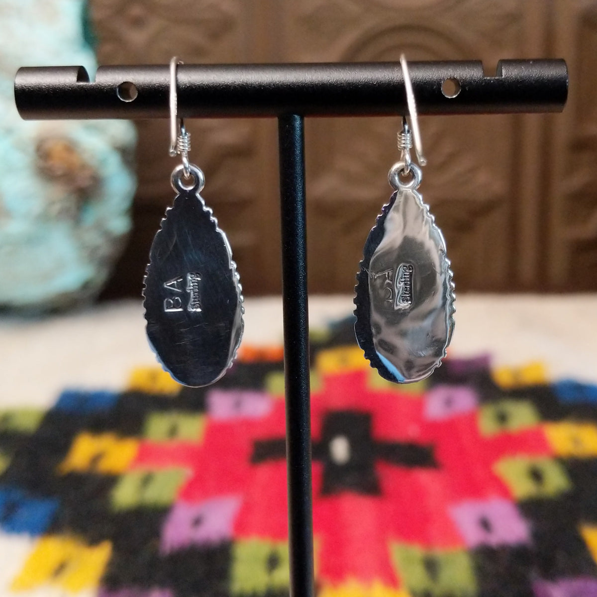 Navajo Wild Horse Teardrop Earrings by B.A. featuring polished white and reddish-brown matrix stones in detailed silver settings with French ear wires; artisan and Sterling Silver stamp.