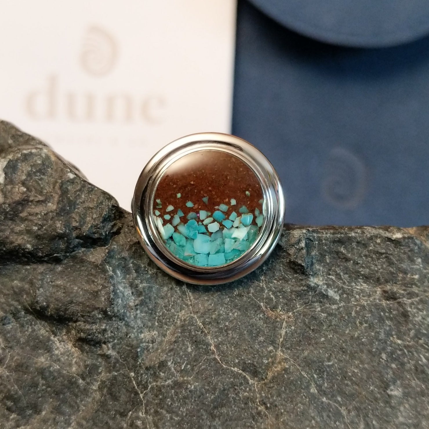 Turquoise flakes and Lake Powell sand set in round sterling silver bezel of the ring.