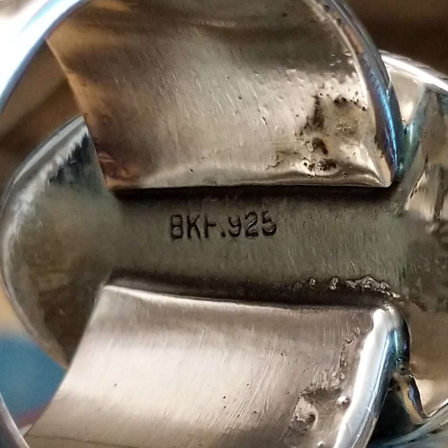 Close-up of the artisan's stamped signature.