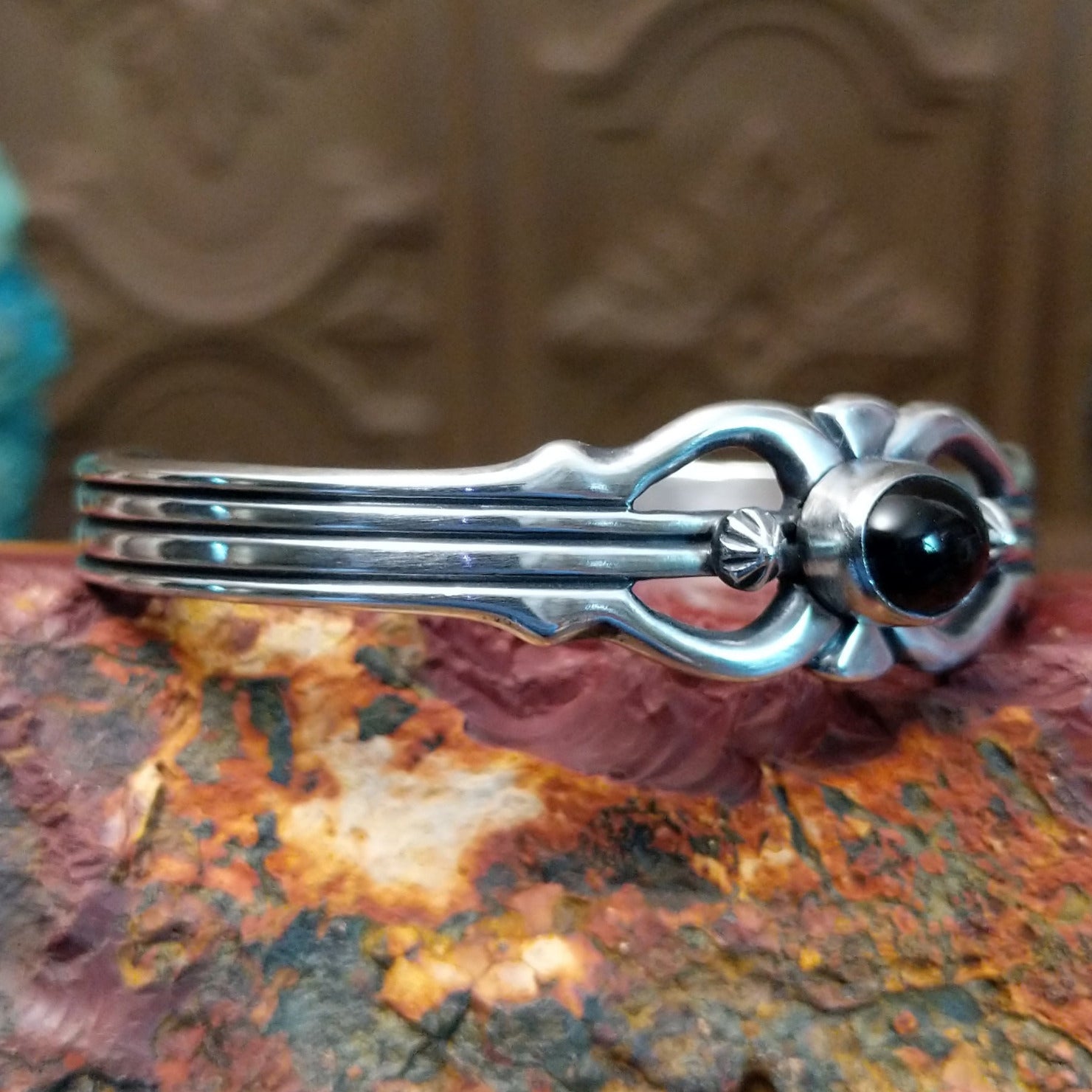 Sterling silver cuff featuring black onyx set in an oval bezel.