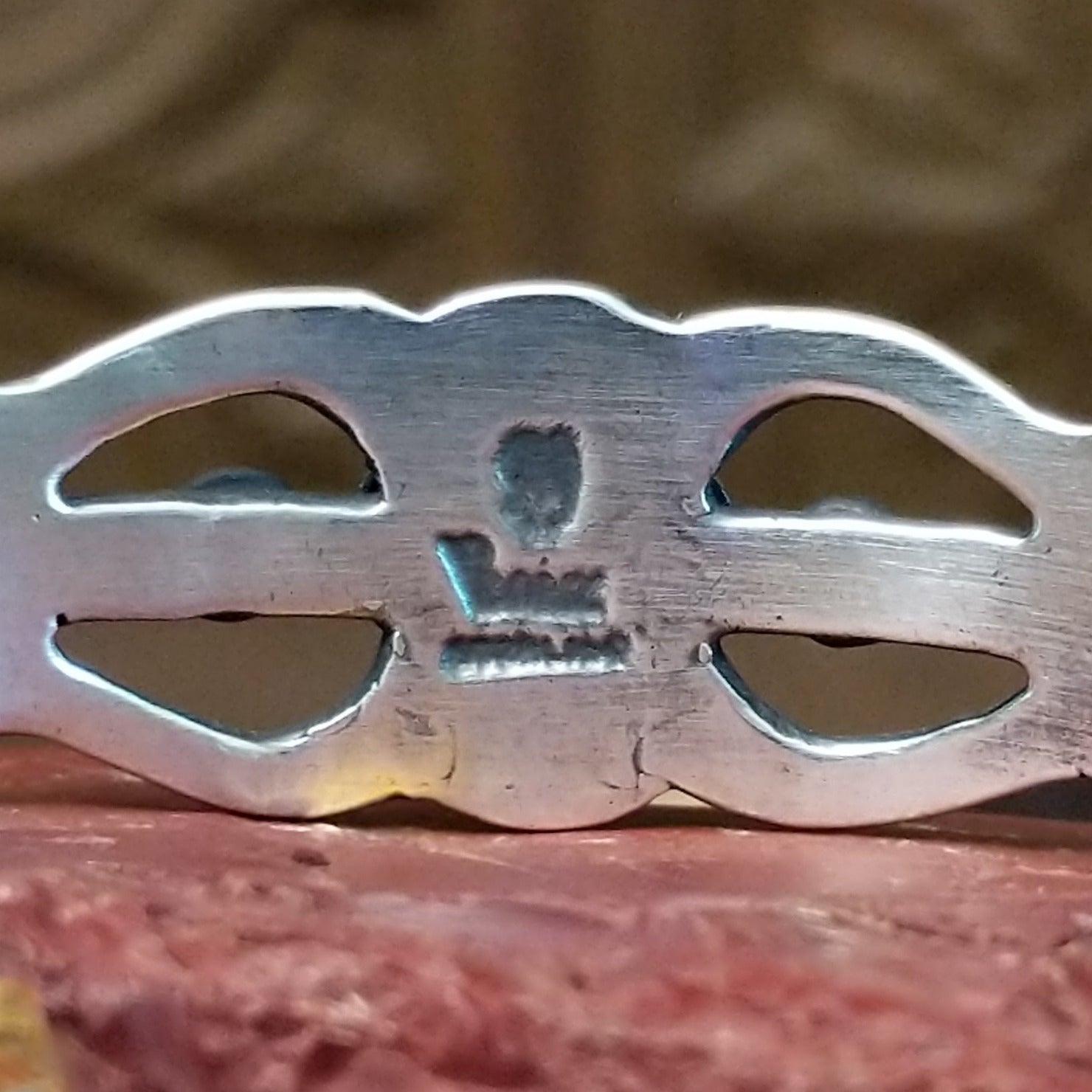 Close-up of artisan's stamped signature.