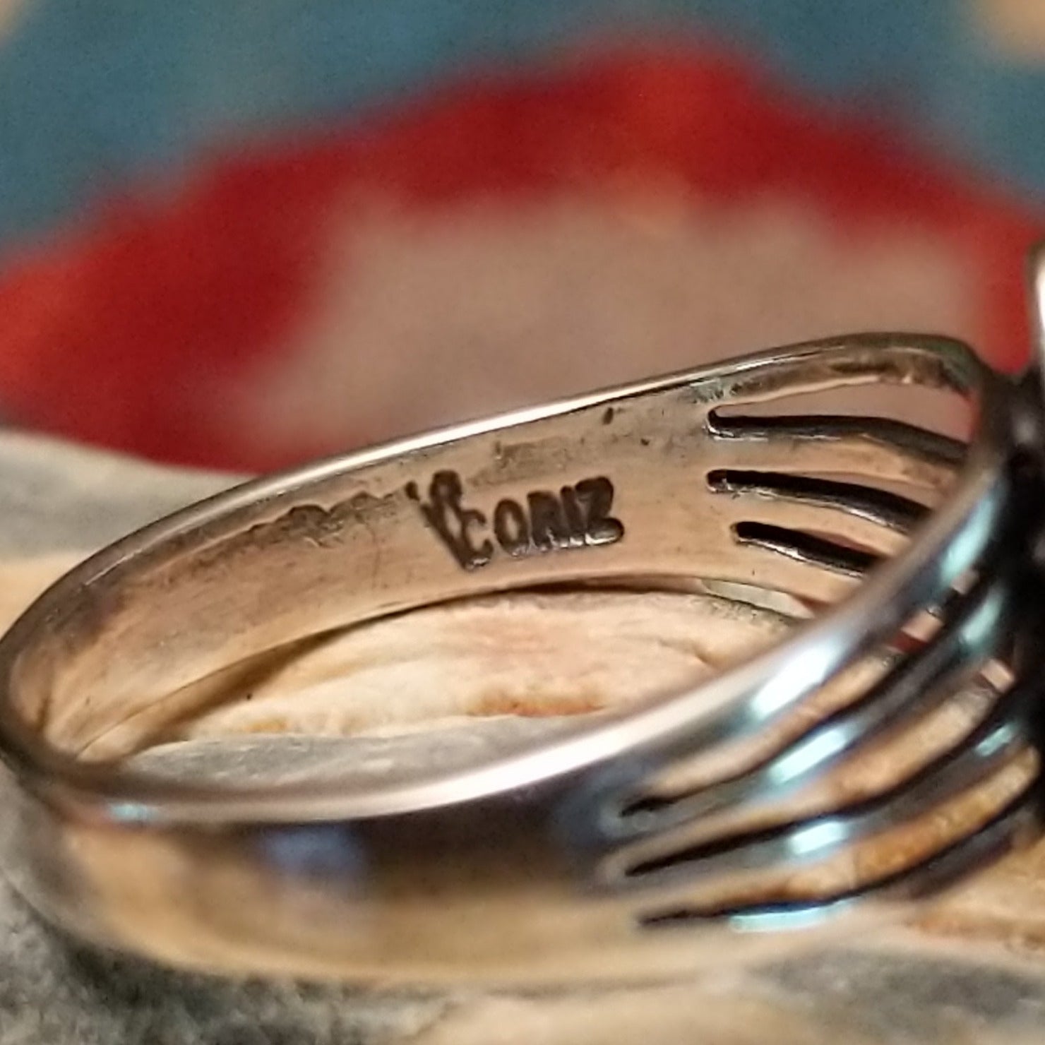 Close-up of the artisan's stamped signature.