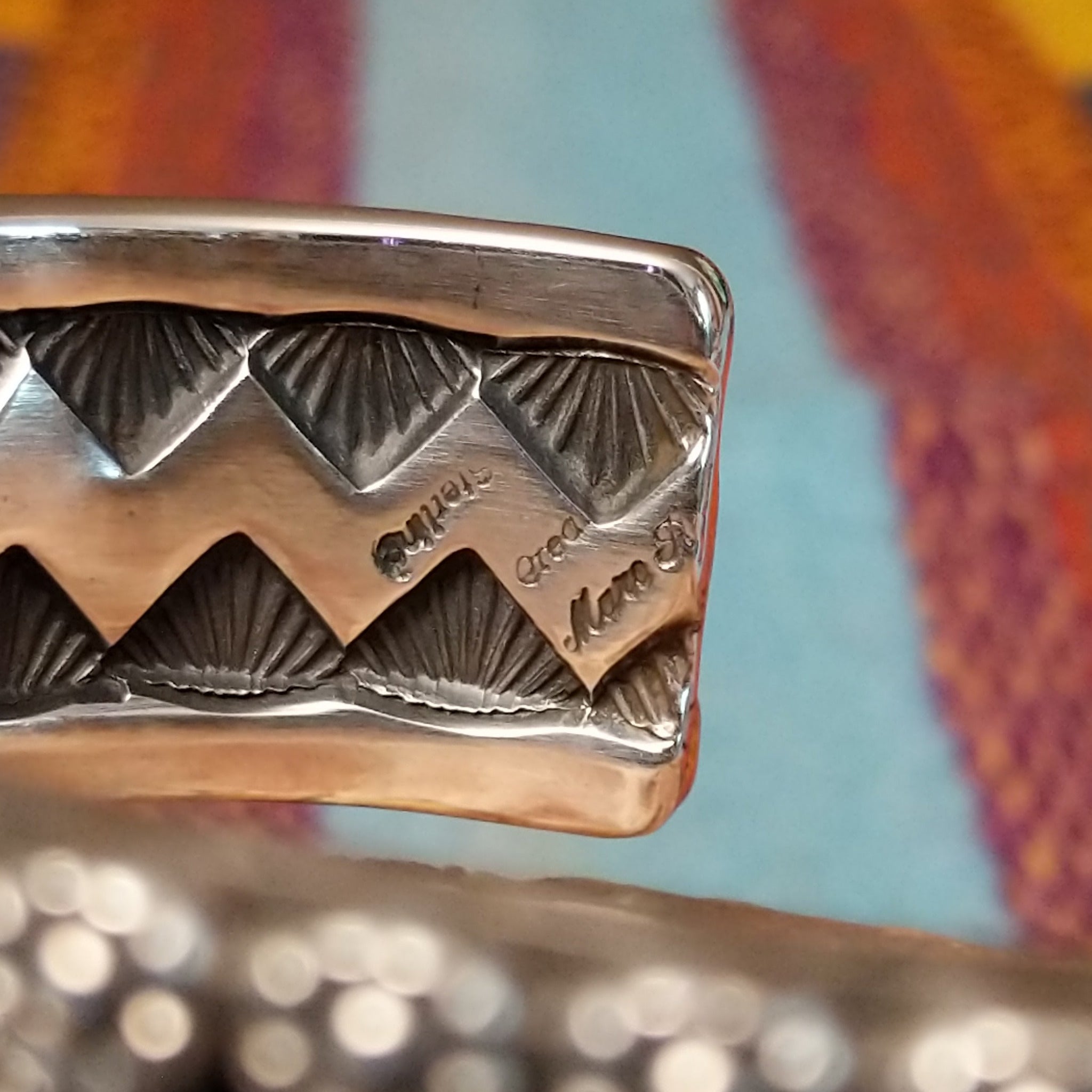Close up of the artist's stamped signature